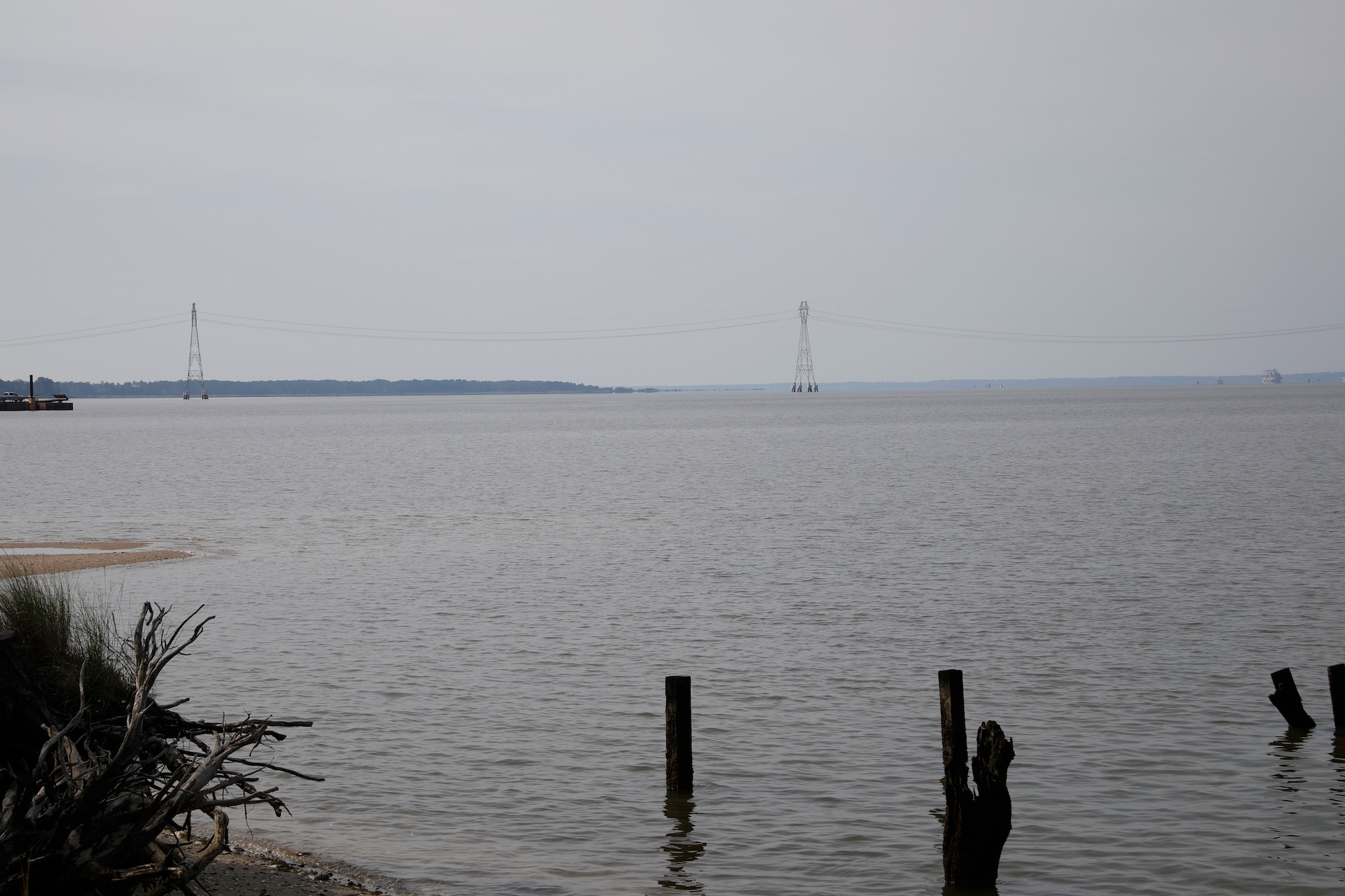 This image was taken along the shoreline at 37,11'58.24"N 76,37'26.03"W, which is on the Carters Grove Plantation property. A 75mm focal length was used as this best matched up the size of the towers  through the viewfinder on a full frame camera with what the human eye was seeing at the location.