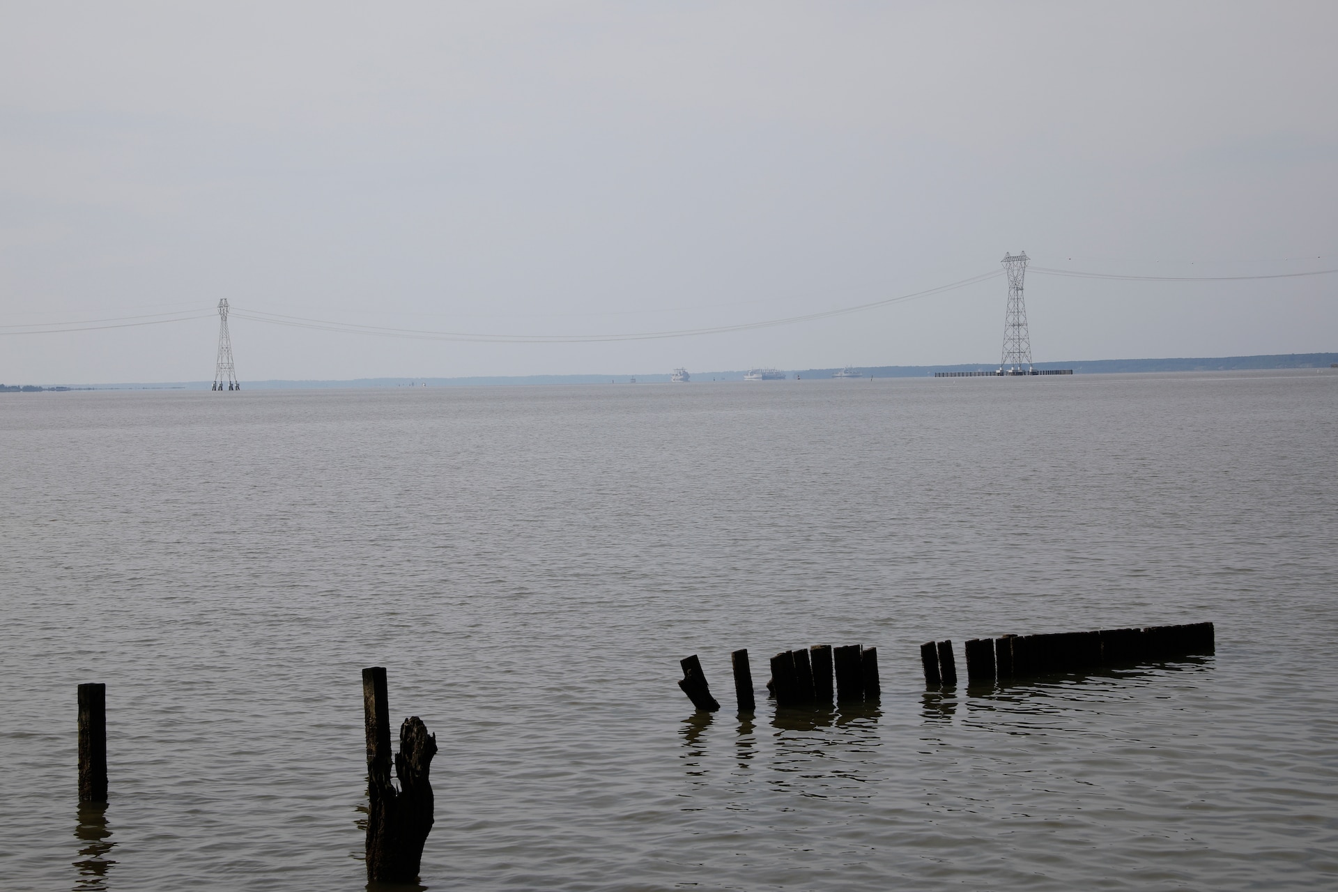 This image was taken along the shoreline at 37,11'58.24"N 76,37'26.03"W, which is on the Carters Grove Plantation property. A 75mm focal length was used as this best matched up the size of the towers  through the viewfinder on a full frame camera with what the human eye was seeing at the location.