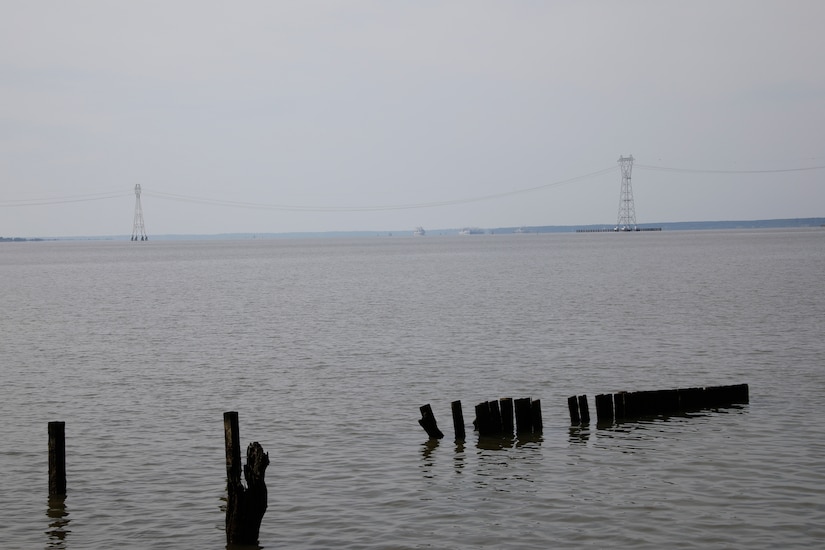 This image was taken along the shoreline at 37,11'58.24"N 76,37'26.03"W, which is on the Carters Grove Plantation property. A 75mm focal length was used as this best matched up the size of the towers  through the viewfinder on a full frame camera with what the human eye was seeing at the location.