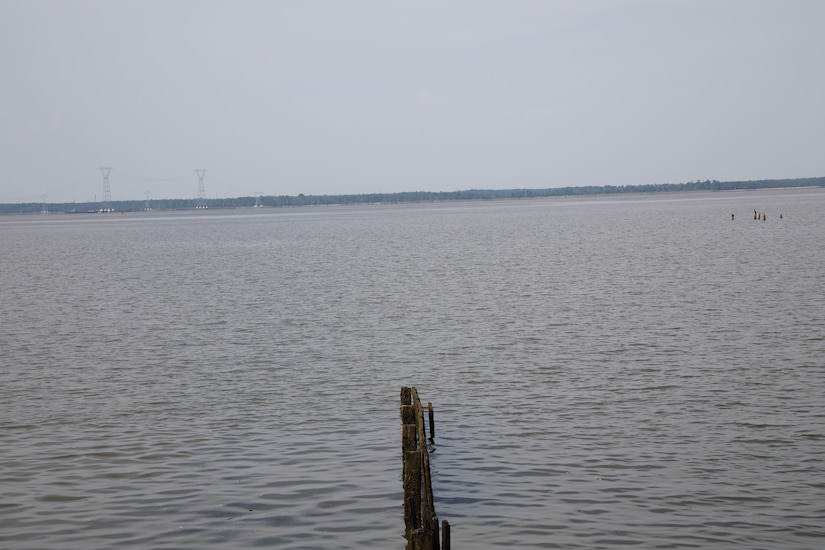 This image was taken along the shoreline at 37,11'58.24"N 76,37'26.03"W, which is on the Carters Grove Plantation property. A 75mm focal length was used as this best matched up the size of the towers  through the viewfinder on a full frame camera with what the human eye was seeing at the location.