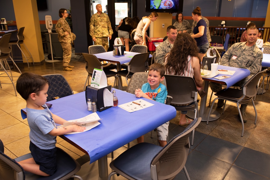 Family members of Airmen from the 23d Wing and 93d Air Ground Operations Wing participate in a Deployed Spouse’s Dinner Aug. 20, 2019, at Moody Air Force Base, Ga.  The dinner served as an opportunity for the families of deployed members to bond and provide relief. The mission’s success depends on resilient Airmen and families, who are prepared to make sacrifices with the support of their fellow Airmen, local communities and leadership. (U.S. Air Force photo by Airman Elijah M. Dority)