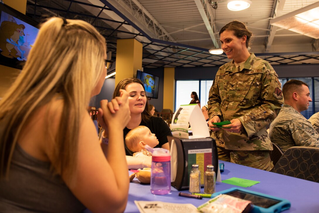 Col. Danielle Willis, right, 93d Air Ground Operations Wing vice commander, talks with participants of a Deployed Spouse’s Dinner Aug. 20, 2019, at Moody Air Force Base, Ga.  The dinner served as an opportunity for the families of deployed members to bond and provide relief. The mission’s success depends on resilient Airmen and families, who are prepared to make sacrifices with the support of their fellow Airmen, local communities and leadership. (U.S. Air Force photo by Airman Elijah M. Dority)