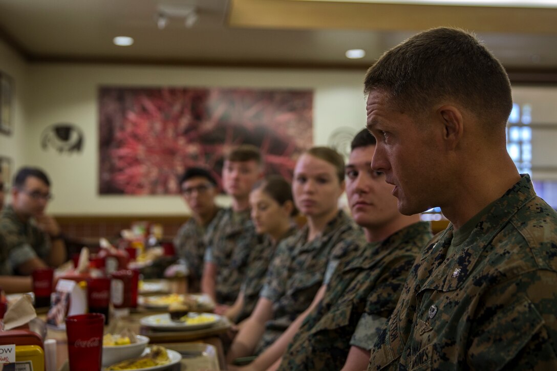 U.S. Marines with Headquarters and Headquarters Squadron (H&HS), eat breakfast and talk with the Commanding Officer and Sergeant Major of H&HS, on Marine Corps Air Station Yuma, Ariz., August 20, 2019. Having breakfast with the Commanding Officer is intended to boost squadron morale as well as give junior Marines an opportunity to familiarize themselves with their chain of command. (U.S. Marine Corps photo by Lance Cpl. John Hall)