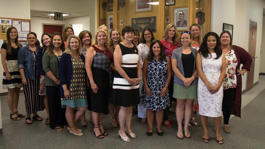 Donna Berger, wife of the Commandant, and Stacie Black, wife of the sergeant major of the Marine Corps, stand with spouses of top Marine Corps Air Station (MCAS) Cherry Point and 2nd Marine Aircraft Wing at MCAS Cherry Point, North Carolina, July 31, 2019. The group participated in a roundtable discussion of topics that centered on morale and welfare of Marines and families of the air station community. (U.S. Marine Corps photo by Lance Cpl. Jacob Bertram)