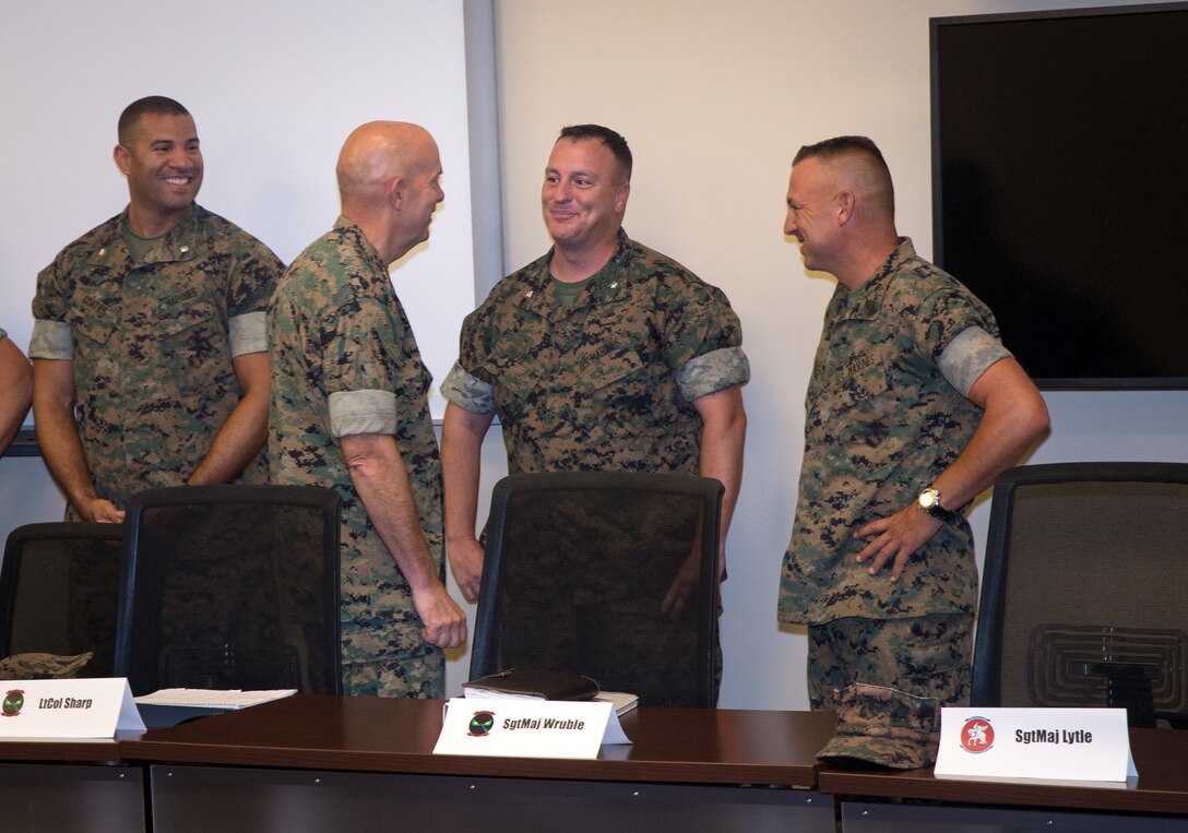 U.S. Marine Corps Commandant Gen. David Berger greets the commanding officers and sergeant’s major of Marine Corps Air Station (MCAS) Cherry Point and 2nd Marine Aircraft Wing during a meeting in the Battle Lab at Marine Air Support Squadron 1 at MCAS Cherry Point, North Carolina, July 31, 2019. Berger and Sgt. Maj. of the Marine Corps Troy Black, sat down with leaders to discuss various issues and topics about the welfare and future of the air station. (U.S. Marine Corps photo by Cpl. Micha Pierce)