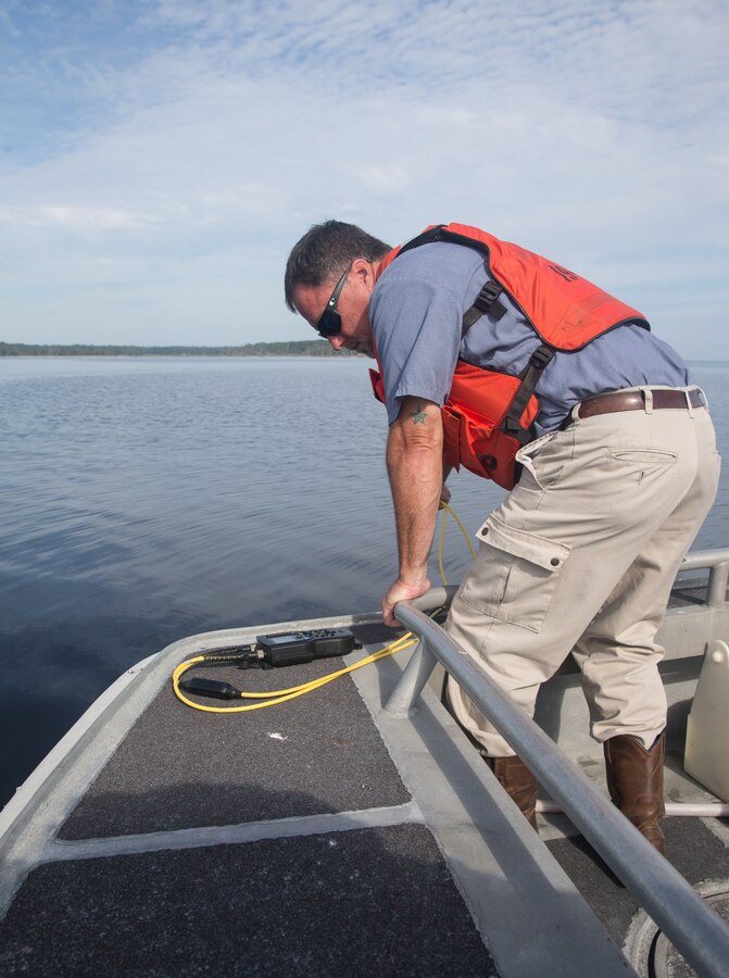 James Carter, with the city of Havelock’s waste water treatment plant, lowers a meter to test levels of certain substances in the water at Marine Corps Air Station (MCAS) Cherry Point, North Carolina, June 27, 2019. Tracking changes in water quality is important to maintaining the health and livelihood of Marines and Sailors on base, as well as civilians in the local area, who depend on clean, reliable water sources. Water quality checks are done once every week to test the chemical, physical, and biological characteristics of the surrounding surface waters to ensure they are safe and abide by regulations upheld by the MCAS Cherry Point Environmental Affairs Department. (U.S. Marine Corps photo by Cpl. Micha Pierce)