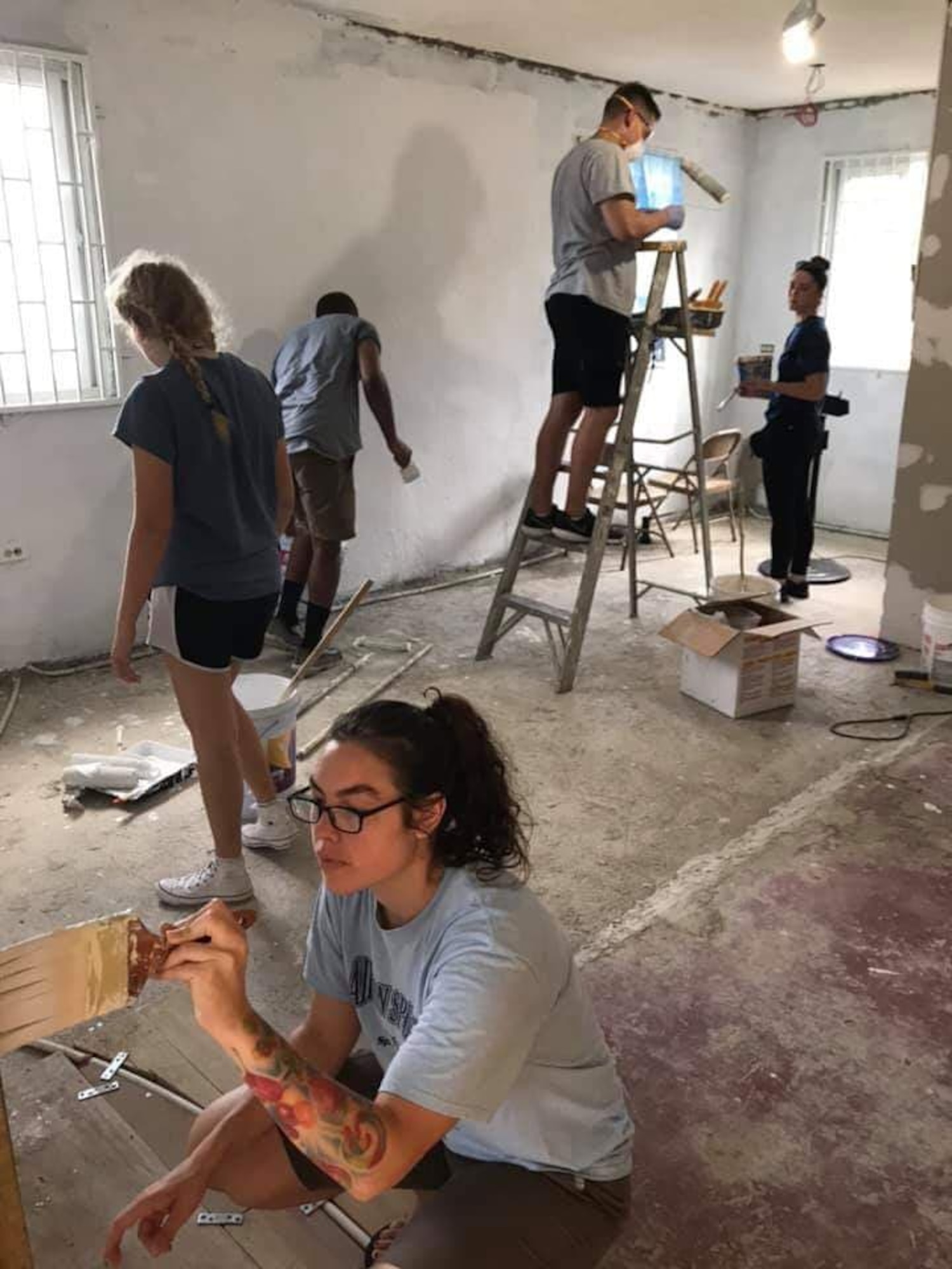 Members of the 21st Space Wing paint the interior of a building during a 21st Space Wing Chapel-sponsored mission trip to Jamaica July 30-Aug. 6, 2019. During the trip wing members renovated a church and built relationships with the local community. (U.S. Air Force courtesy photo)