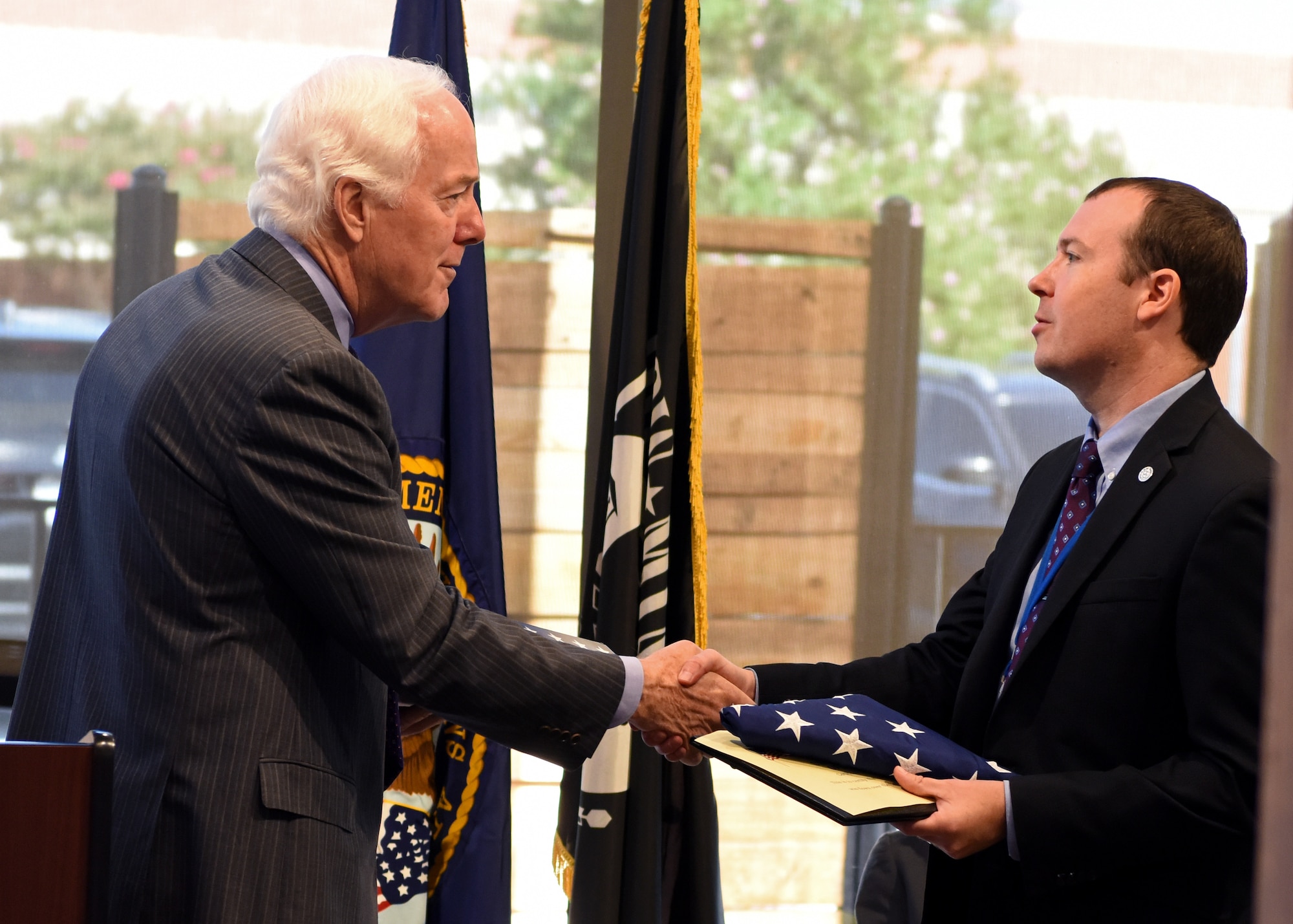 U.S. Senator John Cornyn shakes hands with West Texas Veteran Affairs Interim Director Jason Cave after presenting him a U.S. flag which was flown over The Capitol, at the San Angelo VA clinic ribbon cutting in San Angelo, Texas, August 20, 2019. Cornyn spoke on the importance of veteran healthcare and how Congress is acting on providing veterans with better services. (U.S. Air Force photo by Airman 1st Class Ethan Sherwood/Released)