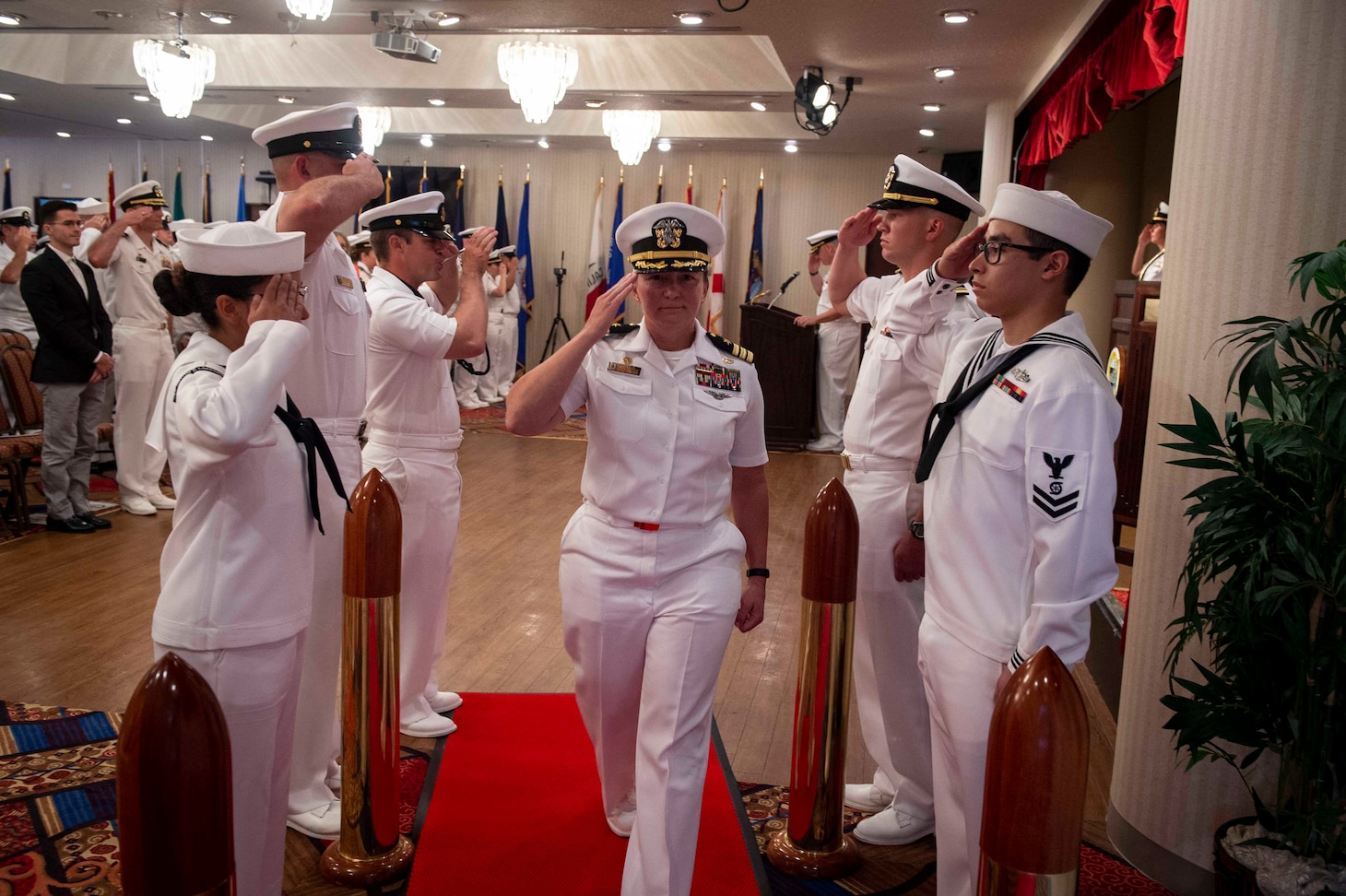 Cmdr. Dawn Allen, commanding officer of the guided missile destroyer USS William P. Lawrence (DDG 110), gets piped aboard during a change of command ceremony held on U.S. Fleet Activities Yokosuka. William P. Lawrence is deployed to the U.S 7th Fleet area of operations in support of security and stability in the Indo-Pacific region.