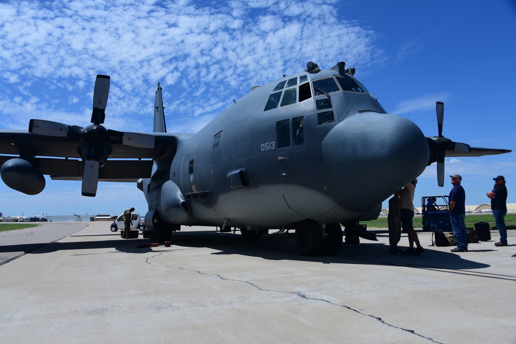 a photo of an AC-130 parked on the flight line