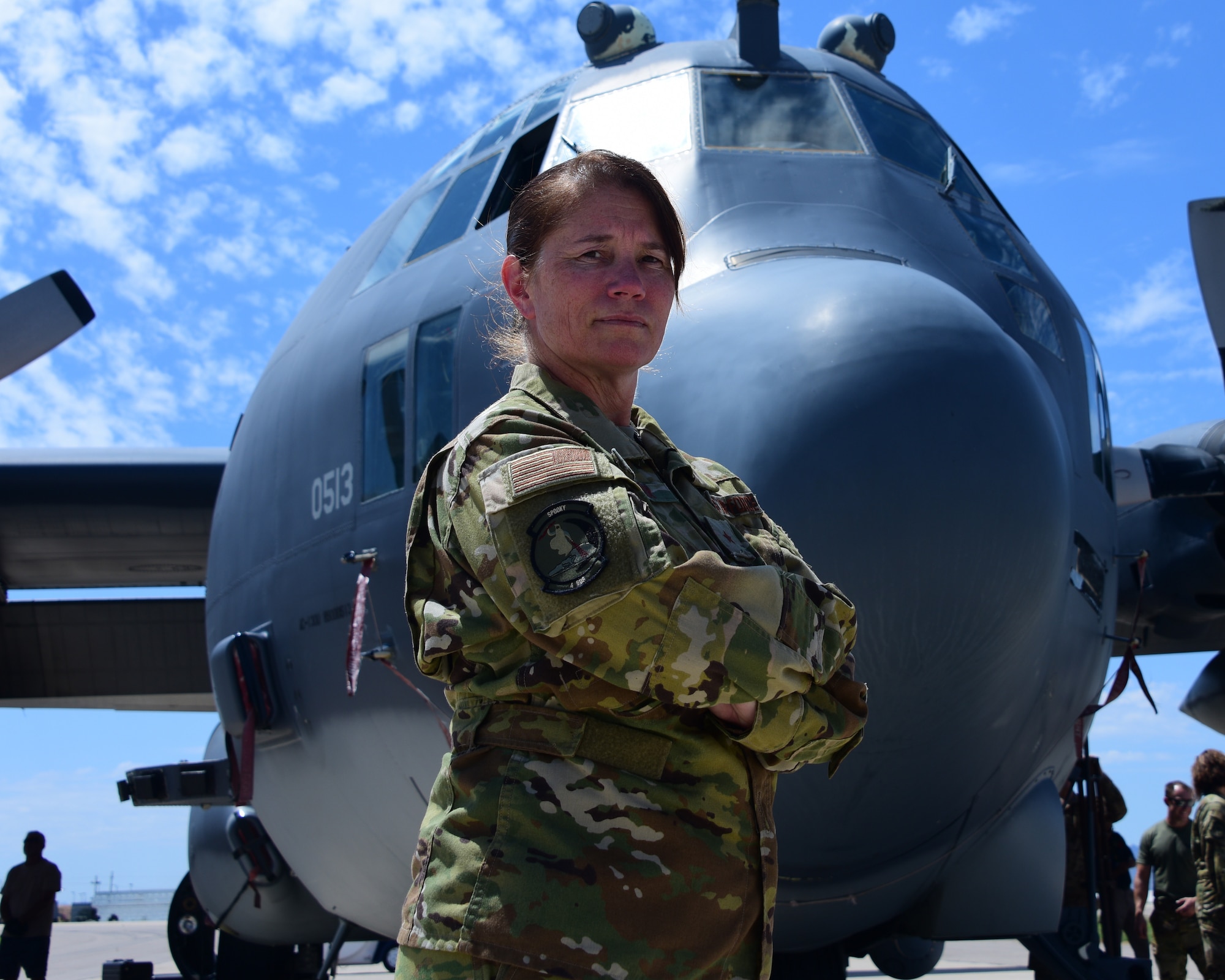 a photo of the pilot posing in front of her AC-130 Gunship