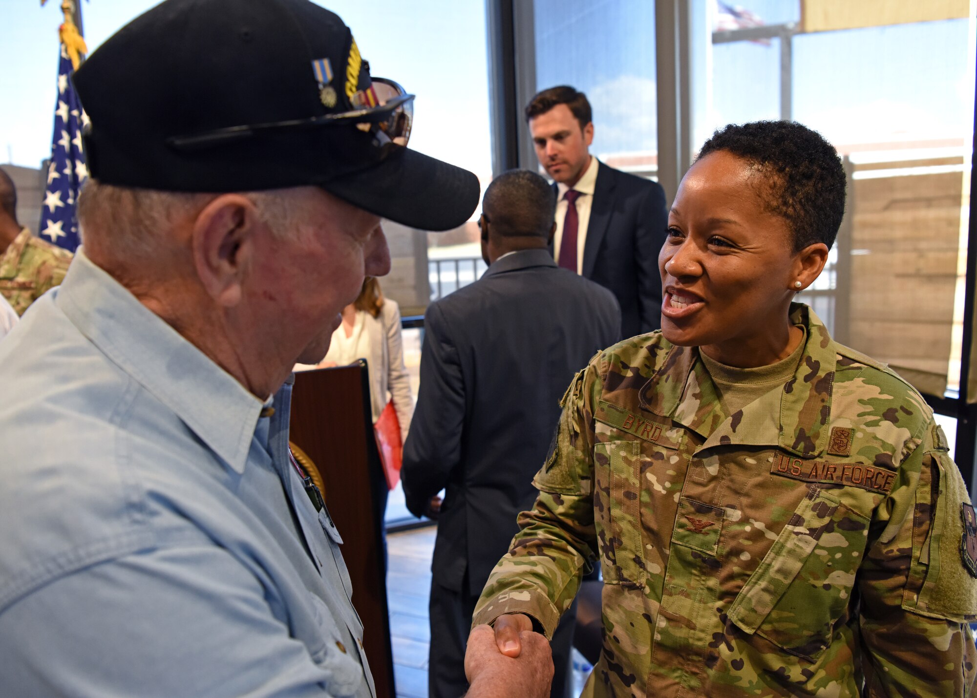 U.S. Air Force Col. Lauren Byrd, 17th Medical Group commander, shakes a veteran’s hand at the Veteran Affairs clinic ribbon cutting in San Angelo, Texas, August 20, 2019. Goodfellow Air Force Base leadership attended the ribbon cutting to show their support and gratitude. (U.S. Air Force photo by Airman 1st Class Ethan Sherwood/Released)