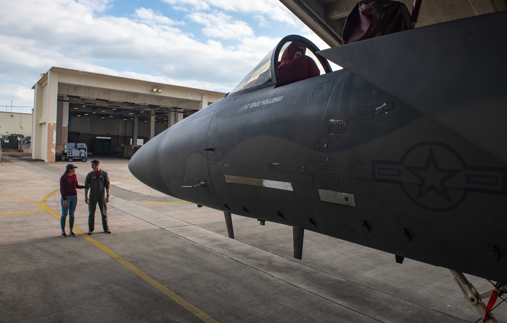 U.S. Air Force Capt. Cole Holloway a pilot from the 67th Fighter Squadron, and his wife, Meghan Holloway, take one last look at an F-15C Eagle assigned to Holloway Dec. 14, 2018, on Kadena Air Base, Japan.