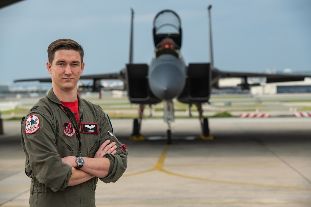U.S. Air Force Capt. Cole Holloway a pilot from the 67th Fighter Squadron, stands in front of an F-15C Eagle Dec. 14, 2018, on Kadena Air Base, Japan.