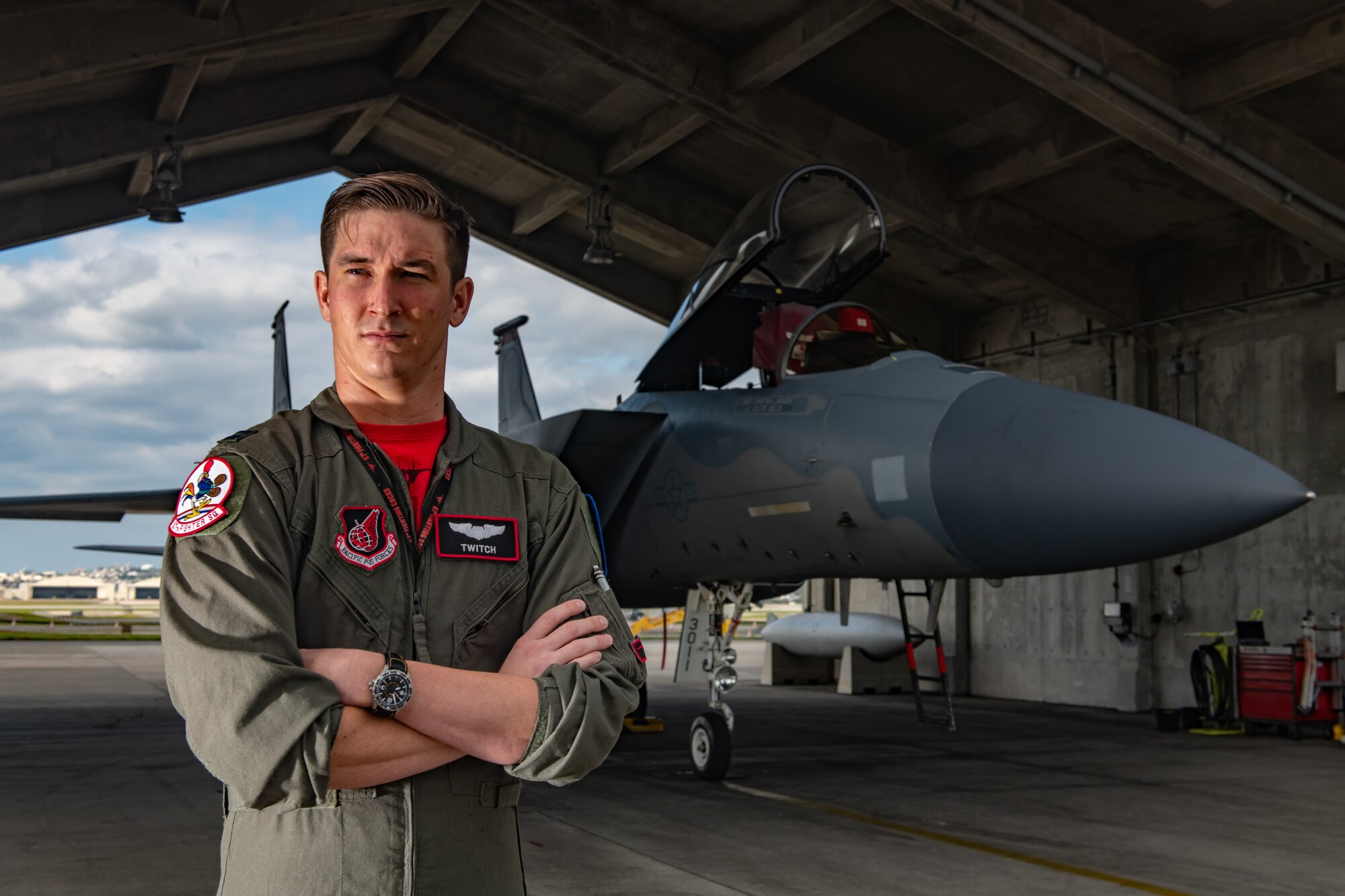 U.S. Air Force Capt. Cole Holloway a pilot from the 67th Fighter Squadron, stands in front of an F-15C Eagle Dec. 14, 2018, on Kadena Air Base, Japan.