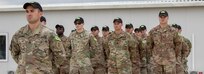 U.S. Army Soldiers, Team Raven, from 1st Armored Brigade Combat Team, 1st Infantry Division, stand in formation during the Georgia Defense Readiness Program - Training (GDRP-T) course completion ceremony at the GDRP Training Center at the Vaziania Training Area, on August 2, 2019.