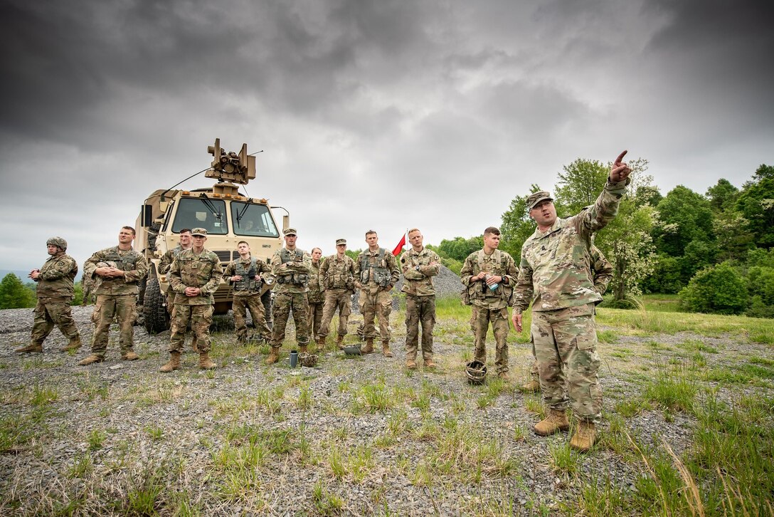 A cadre from the Region II Best Warrior Competition gives directions to the group of competitors prior to the M320 grenade launcher familiarization May 17, 2019, during the Region II Best Warrior Competition at Camp Dawson, West Virginia. This four-day event is designed to measure the physical abilities, leadership skills, teamwork and critical thinking of Soldiers from the West Virginia, District of Columbia, Pennsylvania, Delaware, Maryland and Virginia Army National Guards while completing basic and advanced warrior tasks to crown the region's best warrior. (U.S. Army National Guard photo by Bo Wriston)