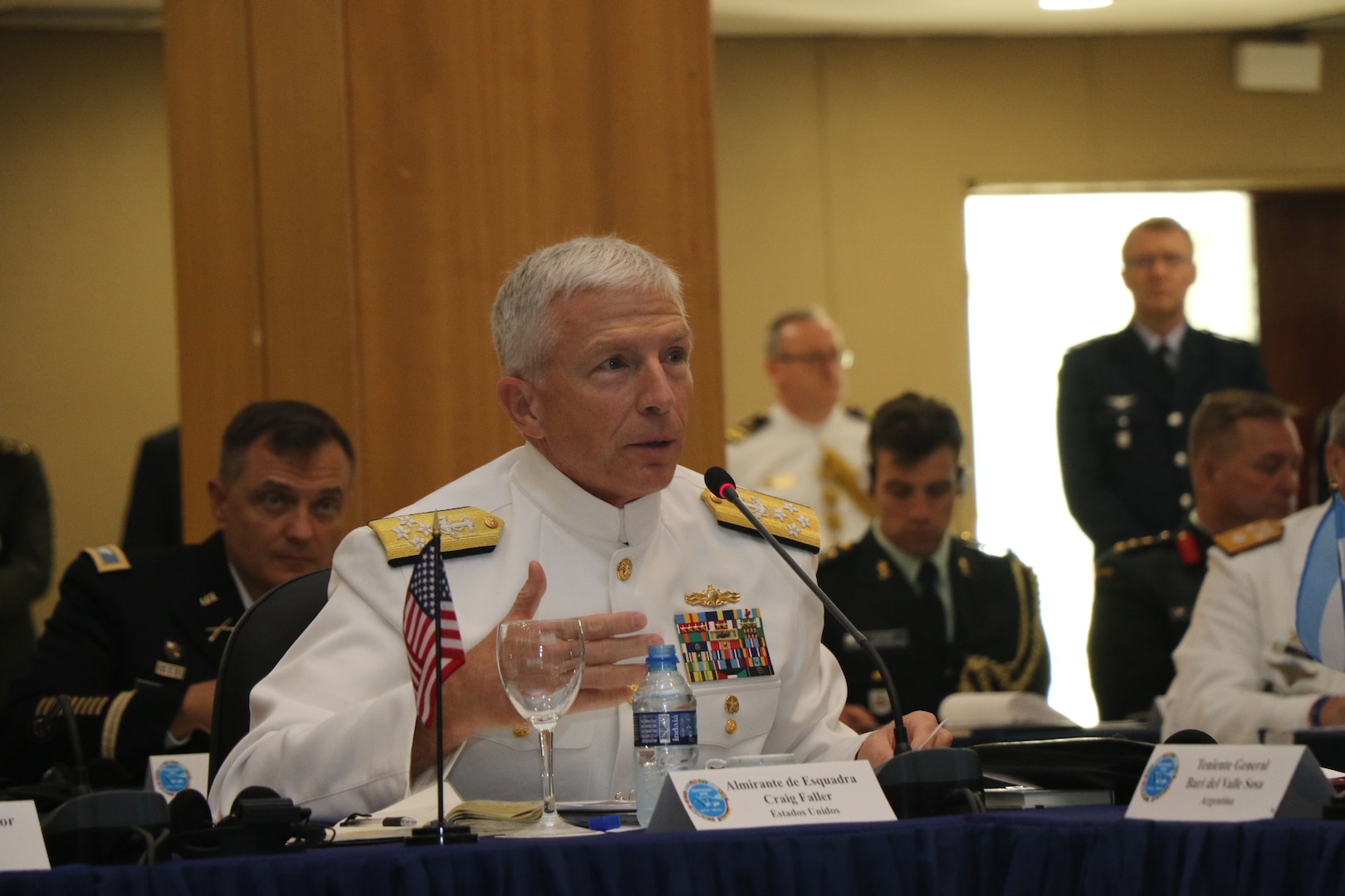 Military leaders speak at a conference.