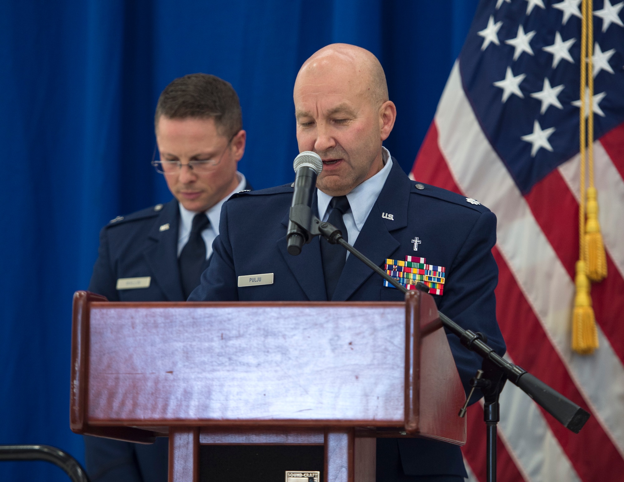 Chaplain (Lt. Col.) Daniel Pulju, 133rd Chapel Corps, gives the invocation at the 133rd Airlift Wing change of command in St. Paul, Minn., Aug. 16, 2019.