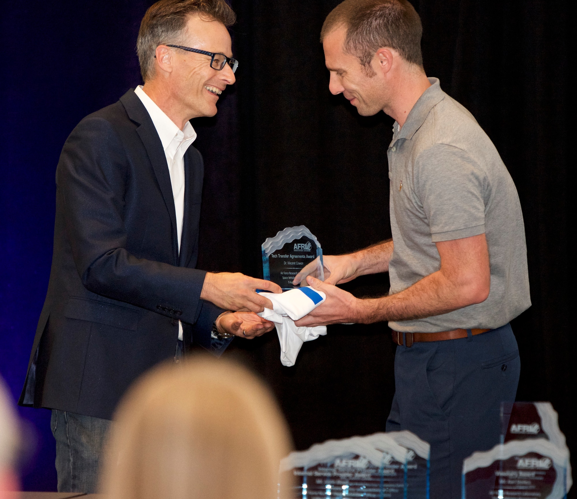 Matt Fetrow, Air Force Research Laboratory Tech Engagement Office director, presents AFRL scientist Dr. Vince Cowan the Tech Transfer Agreement Award at AFRL New Mexico’s 2019 Innovation Awards event held on Aug. 9 in Albuquerque, N.M.