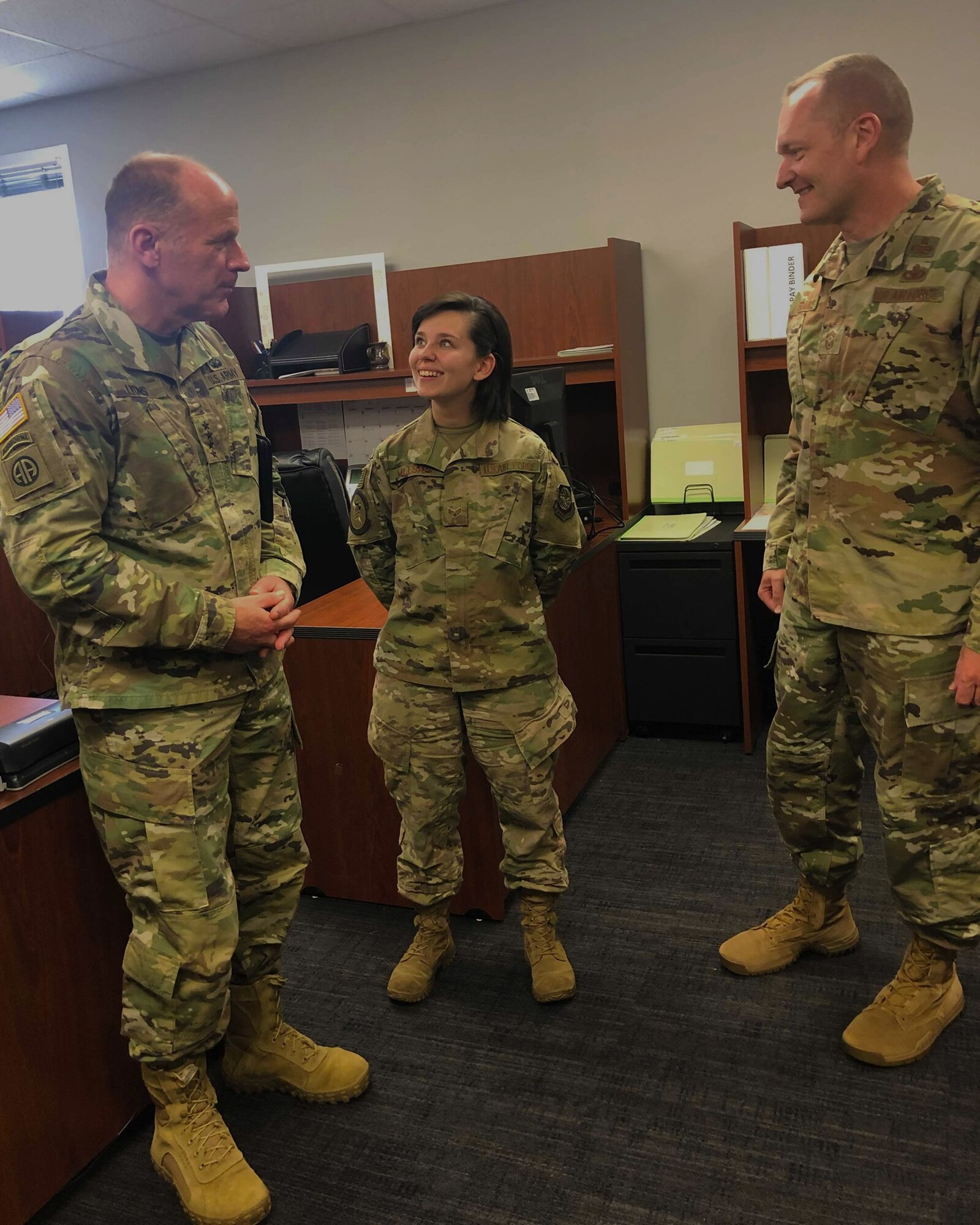 General Lyons and CMSgt France surprise a Pope Airman that they have been selected for promotion.