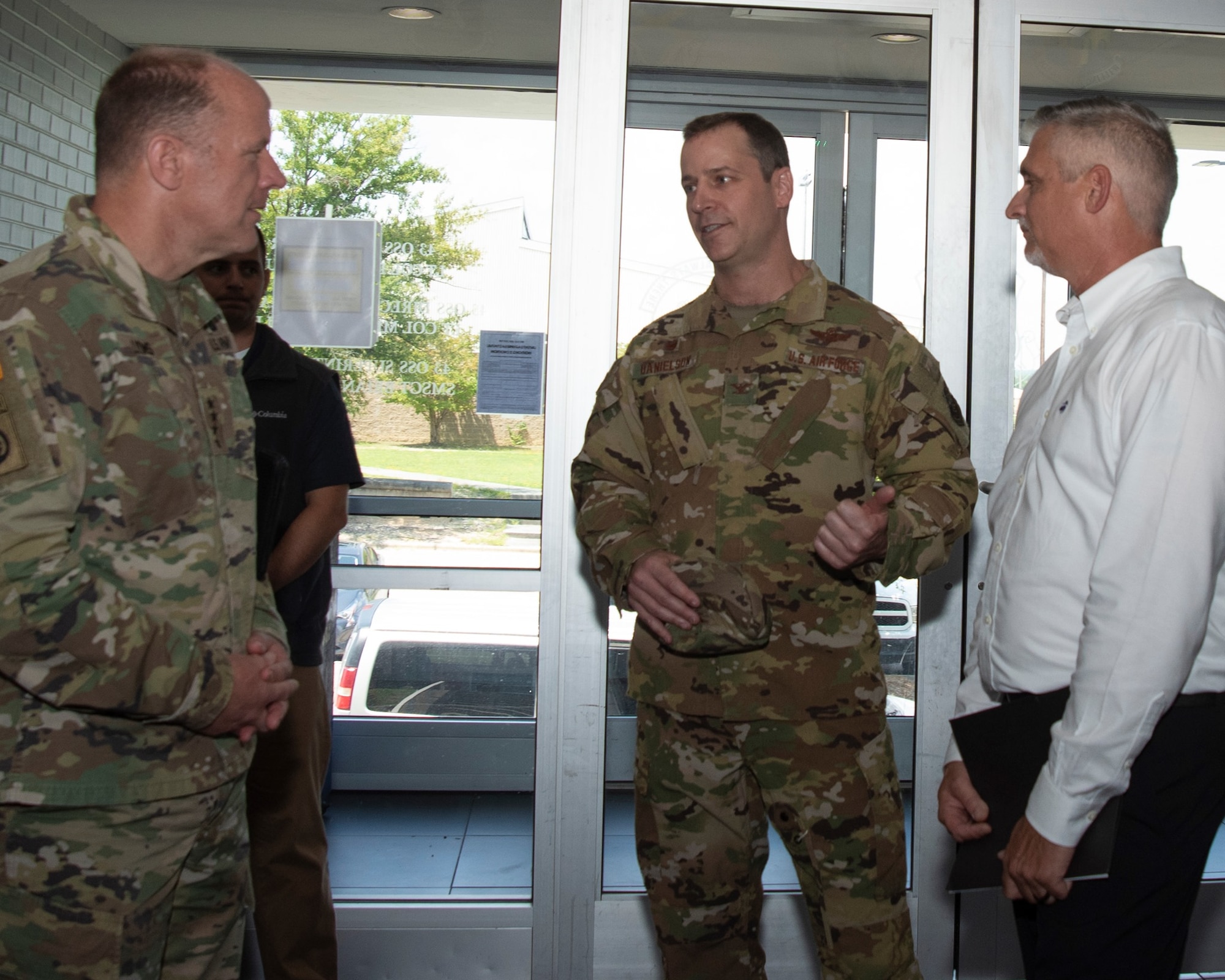 General Lyons and CMSgt France speak with 43 AMOG commander, Col Timothy Danielson during their visit to Pope AAF.