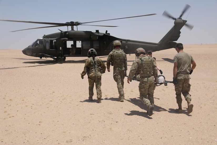 Soldiers of the 8th Assault Helicopter Battalion, 229th Aviation Regiment, also known as Task Force Javelin, conduct medical evacuation training with U.S Air Force Joint Tactical Air Controllers from the 82nd Expeditionary Air Support Operations Squadron,  July 12, 2019, at the Udairi Range Complex  near Camp Buehring, Kuwait. TF Javelin will provide medical evacuation and air assault support as part of Eager Lion 2019, U.S. Central Command’s premiere exercise in the Levant region.