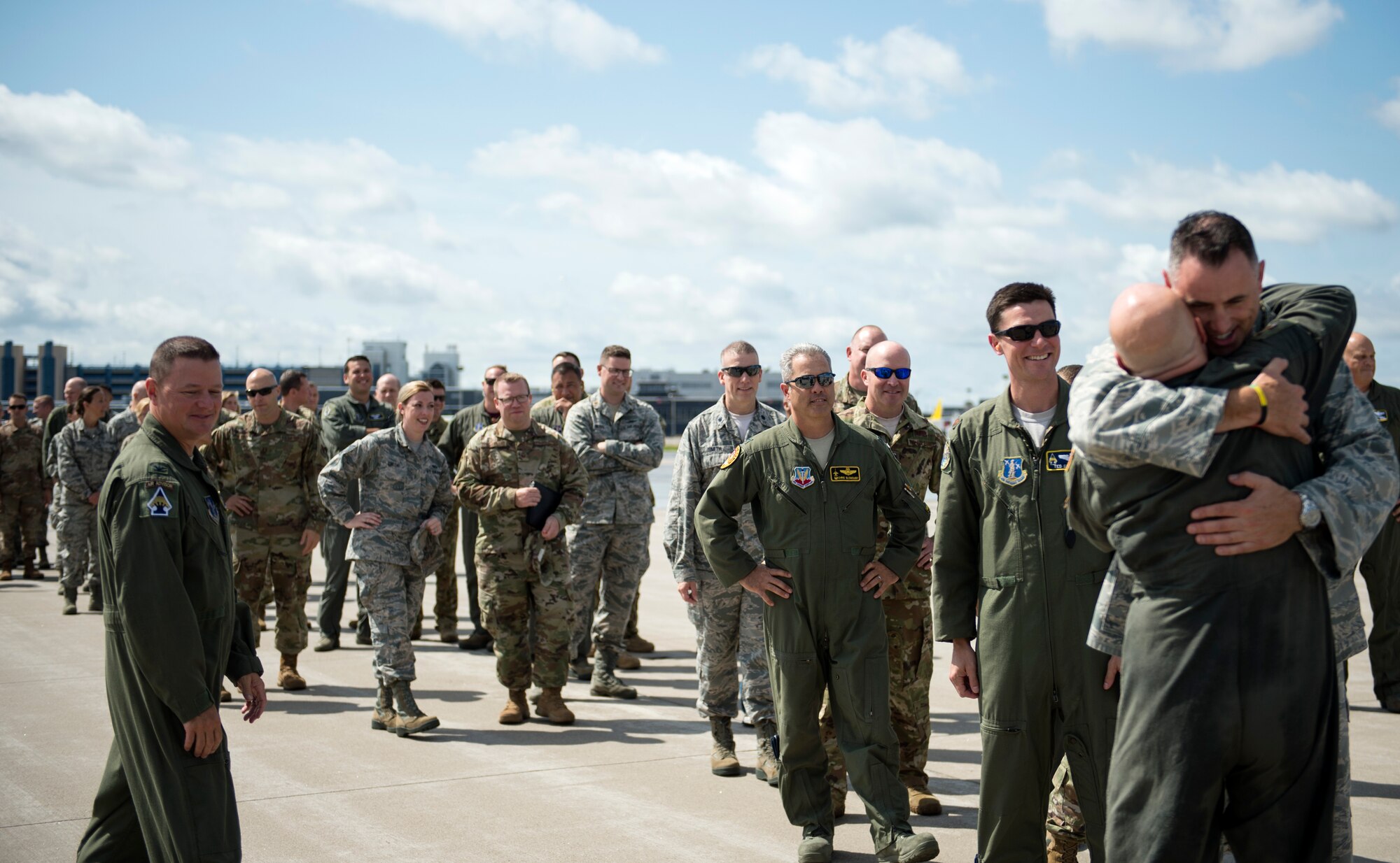 U.S. Air Force Col. Daniel Gabrielli is greeted by Airmen from the 133rd Airlift Wing after completing his fini-flight in St. Paul, Minn., Aug. 16, 2019.