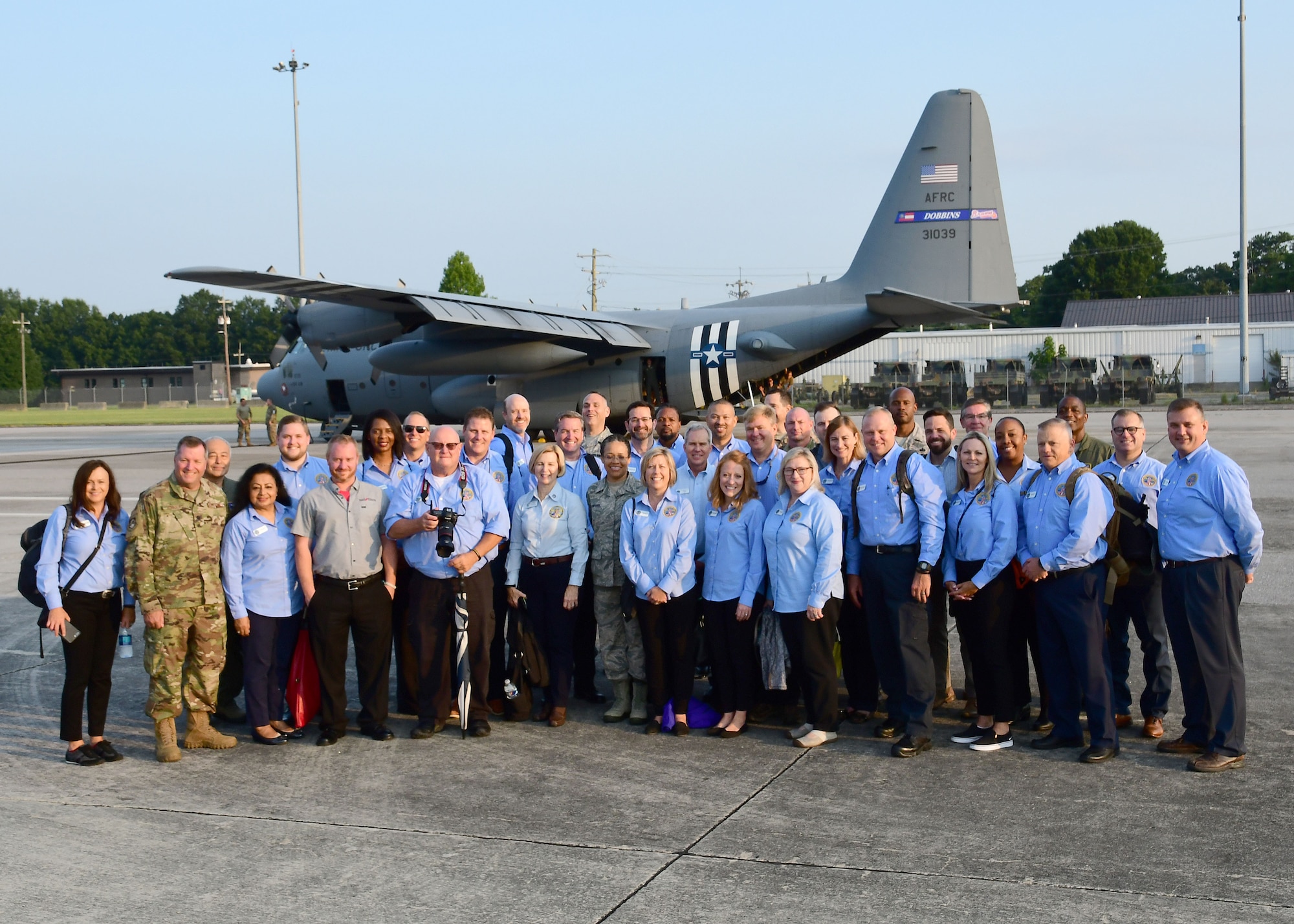 Civic leaders from metro Atlanta pose for a group photo in front of a C-130H3 Hercules at Dobbins Air Reserve Base, Georgia, Aug. 13, 2019.