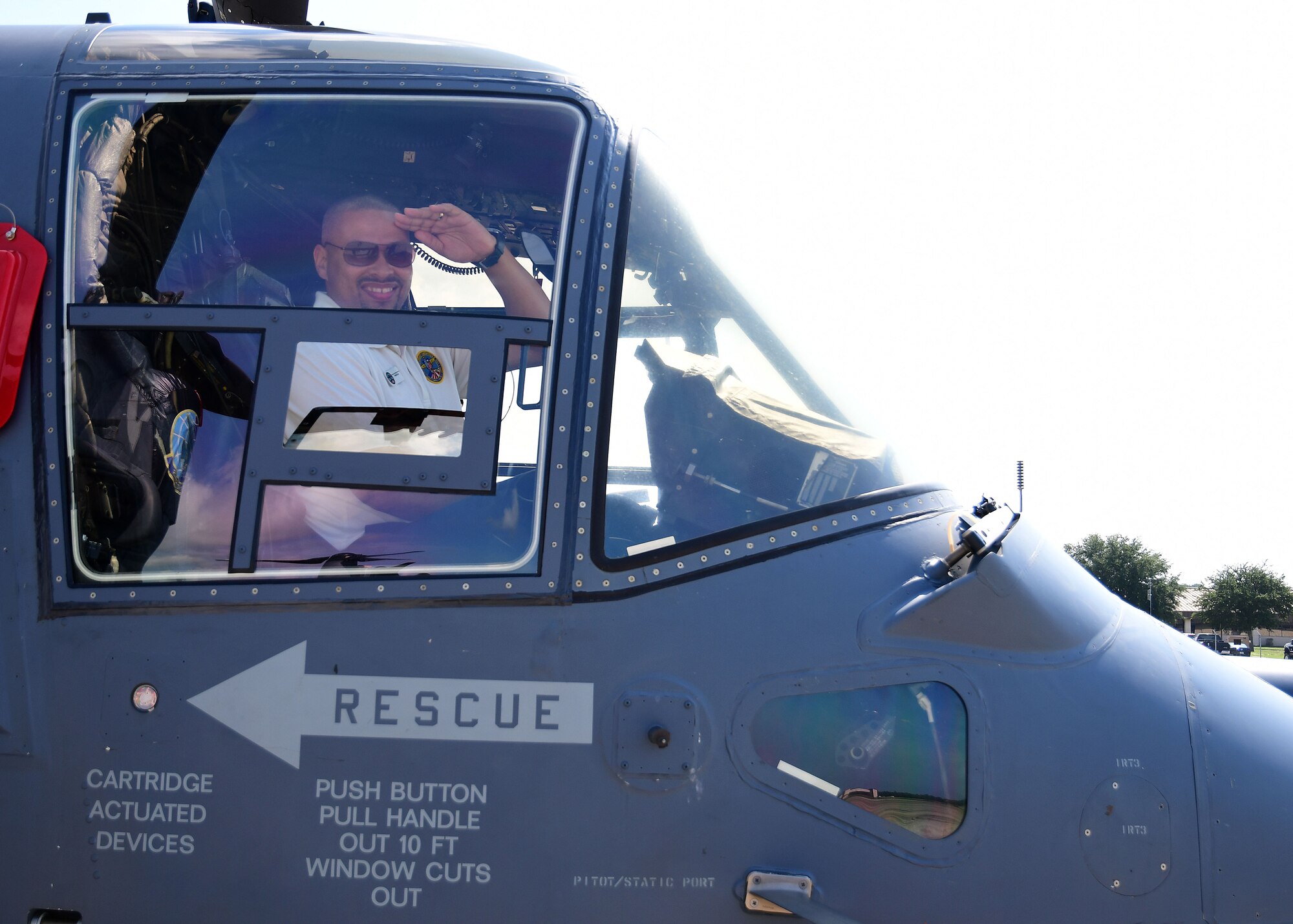 A metro Atlanta civic leader poses for a photo in the cockpit of a CV-22 Osprey at Hurlburt Field, Florida, Aug. 14, 2019.