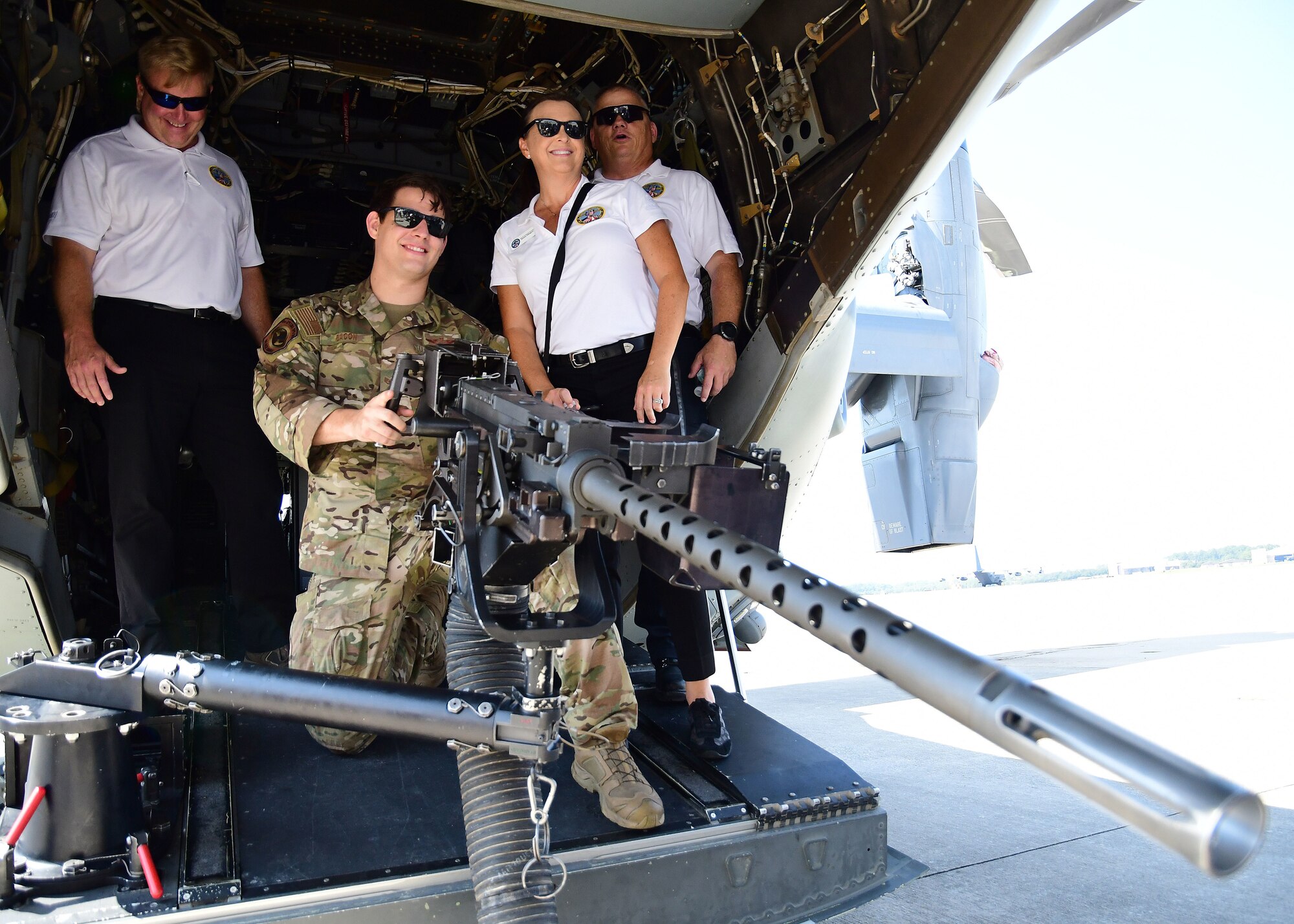 Civic leaders from metro Atlanta pose for a photo with a flight engineer aboard a CV-22 Osprey at Hurlburt Field, Florida, Aug. 14, 2019.