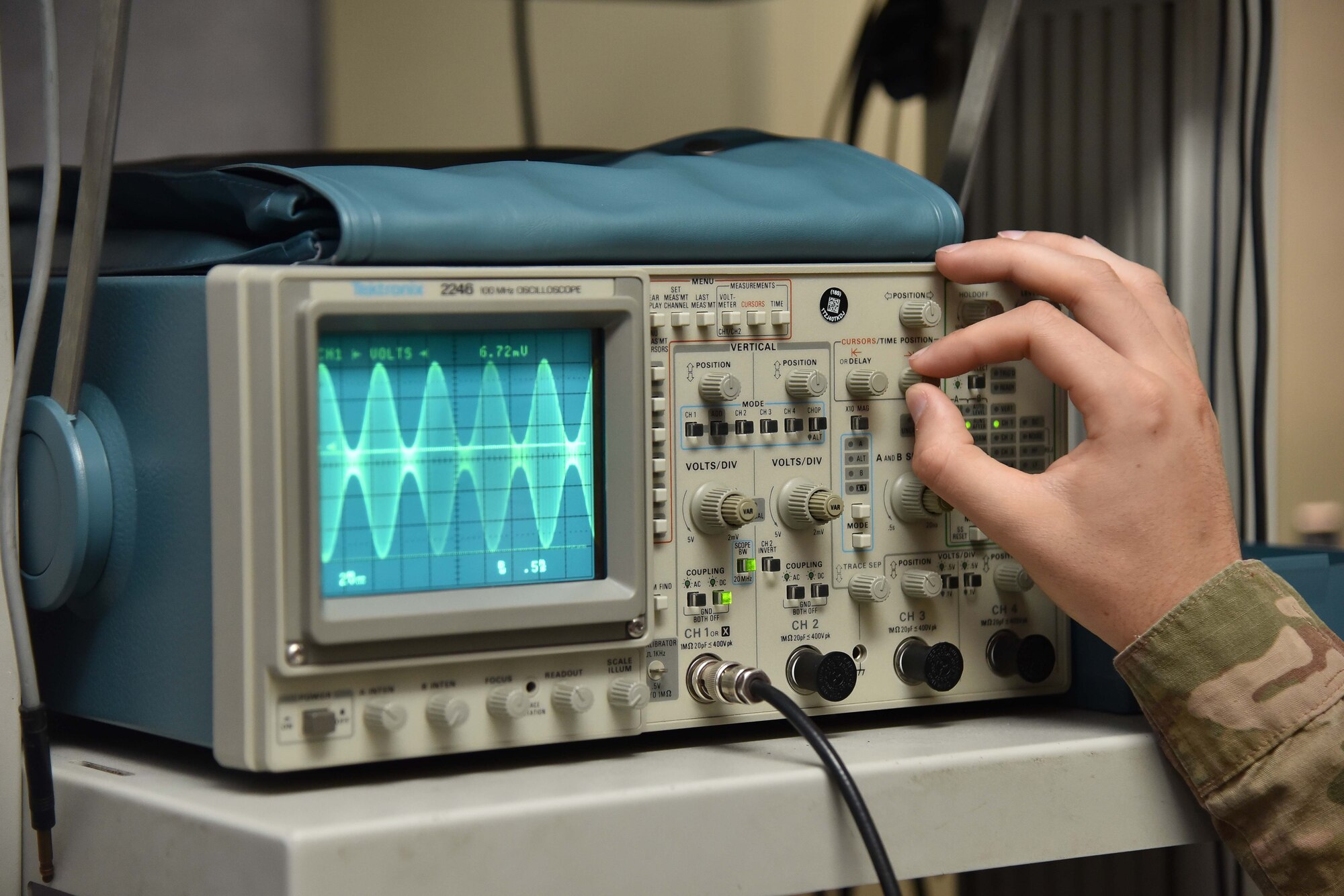 Airman 1st Class Adam Worley, 22nd Operations Support Squadron Radar, Airfield and Weather Systems technician, adjusts the radio frequency on an oscilloscope Aug. 13, 2019, at McConnell Air Force Base, Kan. The oscilloscope is used to create signals and capture responses from electronic devices under test. (U.S. Air Force photo by Airman 1st Class Marc A. Garcia)