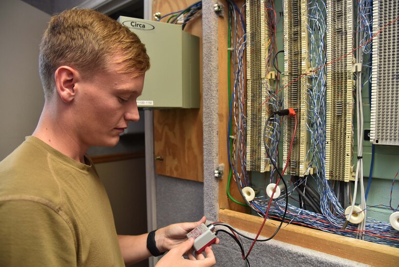 Airman 1st Class Cory Leatherman, Radar, 22nd Operations Support Squadron Airfield and Weather Systems technician, sends a demo signal to test radio frequency lines Aug. 13, 2019, at McConnell Air Force Base, Kan. RAWS radio equipment is vital to the communication between ground and aerial personnel. (U.S. Air Force photo by Airman 1st Class Marc A. Garcia)