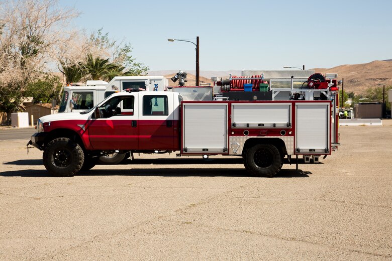 The shorter, smaller and narrower quick response fire engine in front of the larger Type-1 fire engine, is capable of accessing all areas of Marine Corps Logistics Base Barstow, California, without having to use bypass routes to get around the narrow tunnel that leads to the Marine Memorial Golf Course.