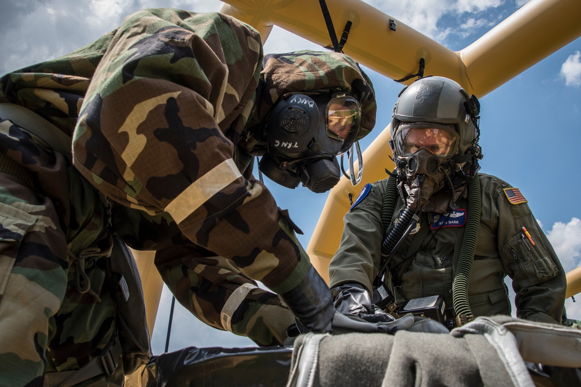 Aircrew from the 164th Airlift Squadron practice the decontamination process during a readiness exercise May 18, 2019, at the 179th Airlift Wing, Mansfield, Ohio. Throughout the exercise, members practiced real-world scenarios in order to increase their readiness. (U.S. Air National Guard photo by Airman 1st Class Alexis Wade)