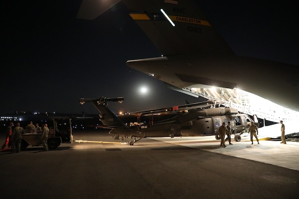 244th Combat Aviation Brigade Soldiers with Task Force Javelin offload a UH-60 Blackhawk helicopter from a U.S. Air Force Strategic Airlift C-17, shortly after arriving to King Abdullah II Air Base, Jordan, in anticipation of Eager Lion 19, Aug. 12, 2019. Eager Lion is U.S. Central Command’s premiere military training exercise in the Levant region. The event provides U.S. forces, Royal Jordanian Armed Forces, and 27 other participating nations the opportunity to improve their collective ability to plan and operate in a coalition environment.
