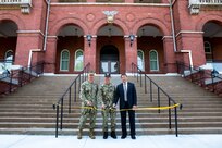 (Left to Right) Norfolk Naval Shipyard's Public Work Officer Cmdr. William Butler, Norfolk Naval Shipyard Commander Captain Kai Torkelson and Whiting-Turner's Division Vice President Sam Abutaleb cuts the ribbon to the newly renovated Building M-32 during a ceremony at Norfolk Naval Shipyard Aug. 22. (Photo by Shelby West, Norfolk Naval Shipyard Photographer)