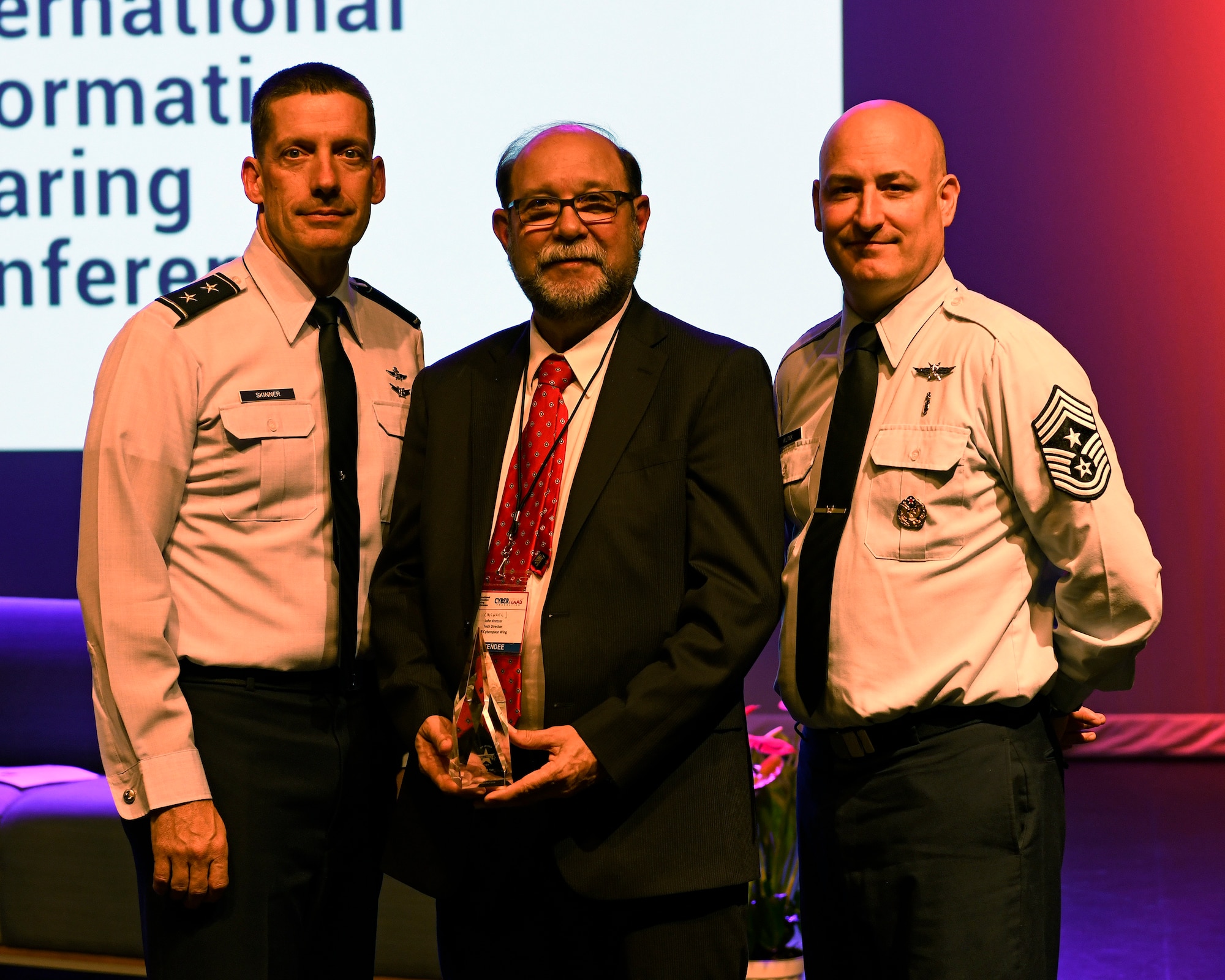 J. Michael Kretzer, 688th Cyberspace Wing technical director, poses for a photo with Maj. Gen. Robert Skinner, 24th Air Force commander, and Chief Master Sgt. David Klink, 24th AF command chief, after being inducted into the CyberTexas Foundation’s 2019 Cyber Hall of Honor in San Antonio, Aug. 20, 2019. Kretzer was honored for his nearly 45 years of cybersecurity service to the nation. (U.S. Air Force photo by Tech. Sgt. R.J. Biermann)