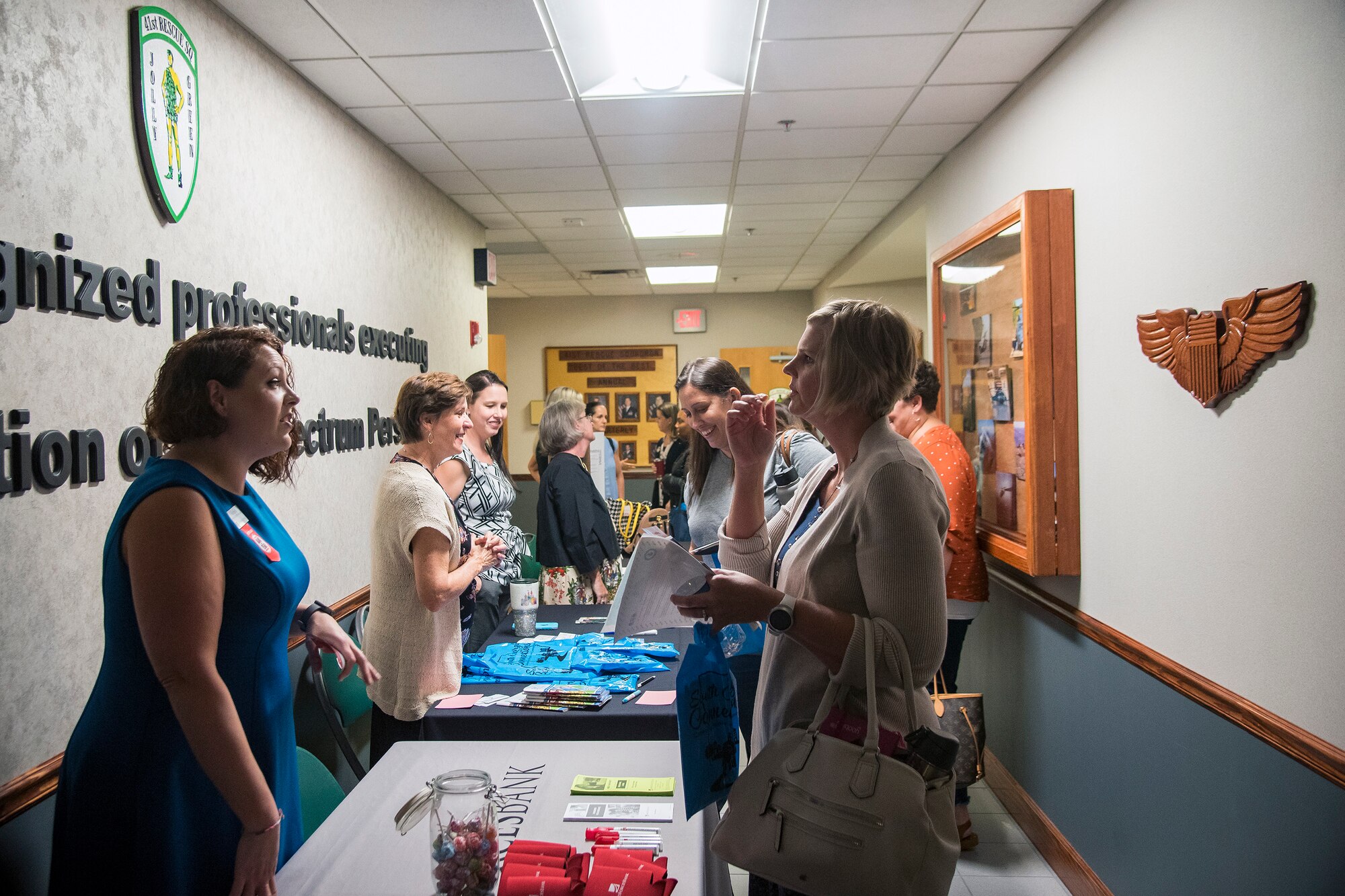 Team Moody spouses, right, speak to various support agencies during a Heart Link spouse orientation Aug. 21, 2019, at Moody Air Force Base, Ga. The orientation is geared toward providing all spouses and family members with the necessary support and information to ensure that they are aware of the resources available to them such as: Tricare, legal assistance, Airman and Family Readiness Center and financial assistance. (U.S. Air Force photo by Airman 1st Class Eugene Oliver)