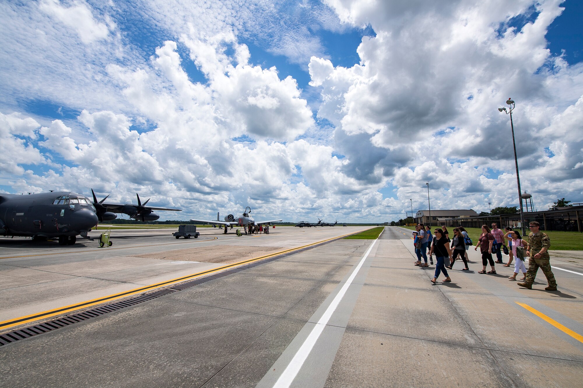 Team Moody spouses, right, walk the flightline during a Heart Link spouse orientation Aug. 21, 2019, at Moody Air Force Base, Ga. The orientation is geared towards providing all spouses and family members with the necessary support and information to ensure that they are aware of the resources that are available to them such as: Tricare, Legal, Airman and Family Readiness Center, and financial assistance. During the orientation, spouses were given a static display tour to better familiarize them with the aircraft and mission here. (U.S. Air Force photo by Airman 1st Class Eugene Oliver)