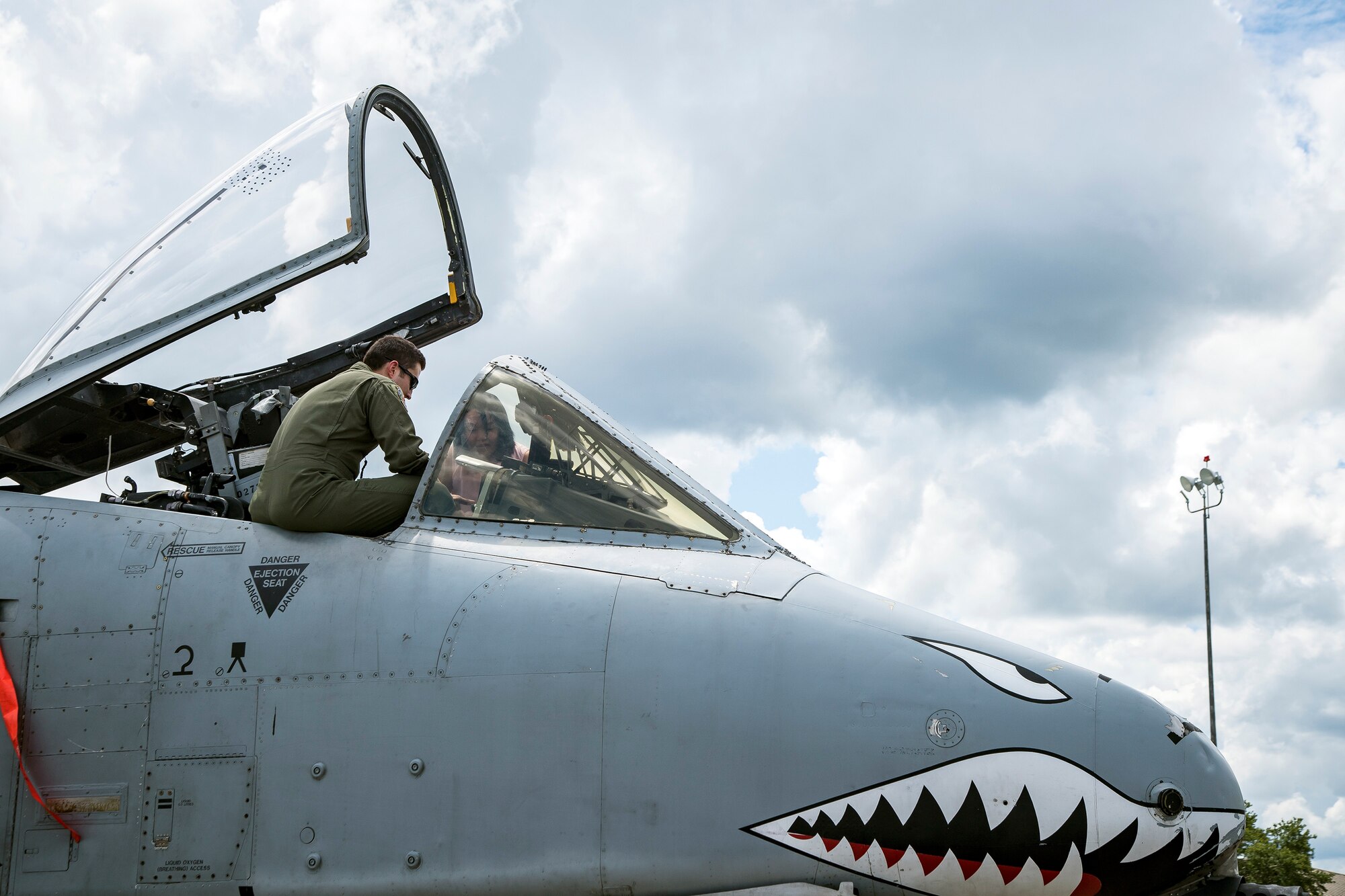 Capt. Travis Jackson, 74th Fighter Squadron A-10C Thunderbolt II pilot, explains the components of the cockpit to a Team Moody spouse during a Heart Link spouse orientation Aug. 21, 2019, at Moody Air Force Base, Ga. The orientation is geared towards providing all spouses and family members with the necessary support and information to ensure that they are aware of the resources that are available to them such as: Tricare, Legal, Airman and Family readiness center, Finance. During the orientation, spouses were given a static display tour to better familiarize them with the aircraft and mission here. (U.S. Air Force photo by Airman 1st Class Eugene Oliver)