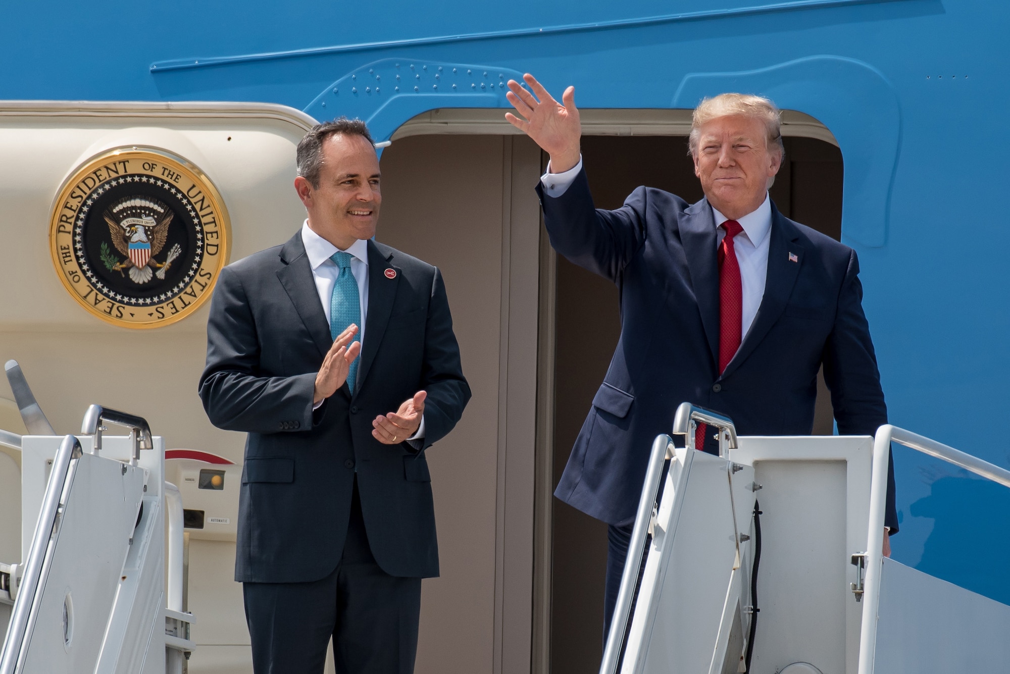President Donald Trump (right) and Kentucky Gov. Matt Bevin greet supporters as they arrive at the Kentucky Air National Guard Base in Louisville, Ky., Aug. 21, 2019. Trump was in town to speak at an AMVETS convention and attend a fundraiser for Bevin’s re-election campaign. (U.S. Air National Guard photo by Dale Greer)