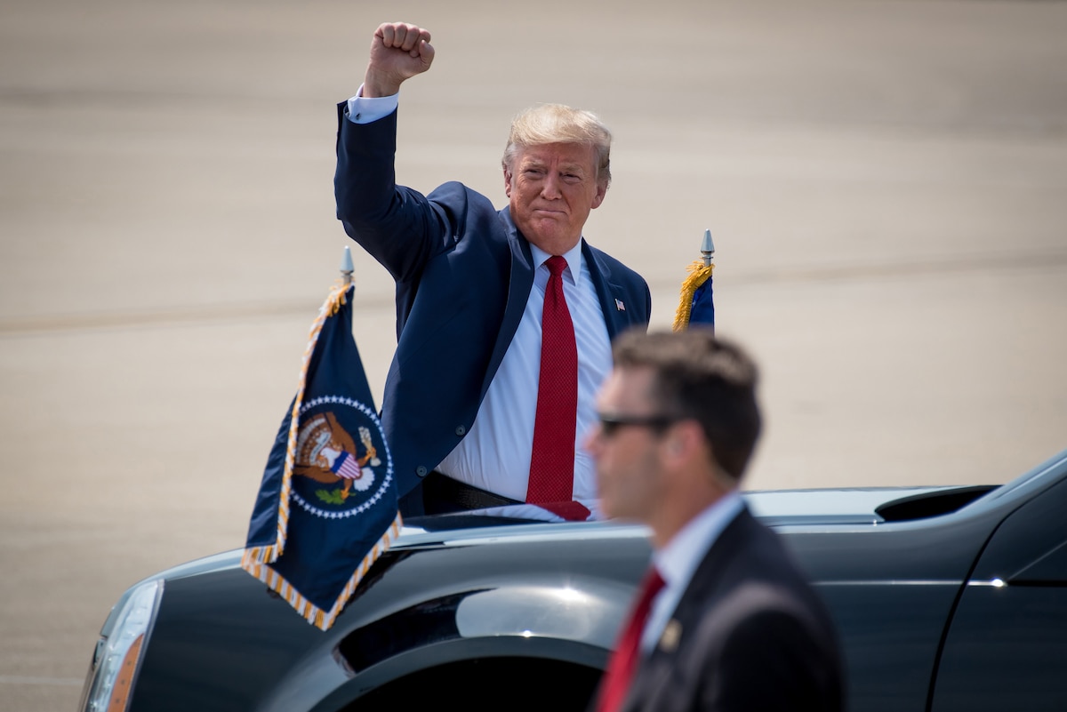 President Donald Trump greets supporters as he arrives at the Kentucky Air National Guard Base in Louisville, Ky., Aug. 21, 2019. Trump was in town to speak at an AMVETS convention and attend a fundraiser for Kentucky Gov. Matt Bevin’s re-election campaign. (U.S. Air National Guard photo by Dale Greer)