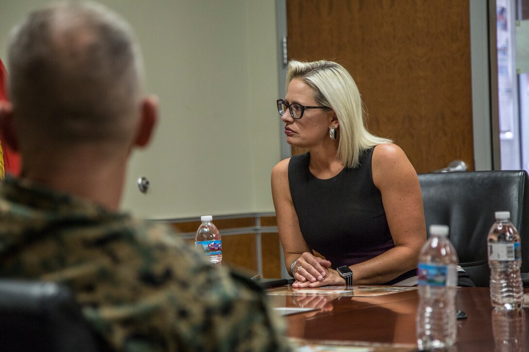 U.S. Senator from Arizona, Kyrsten Sinema, visits Marine Corps Air Station (MCAS) Yuma, Ariz., August 21, 2019. Sen. Sinema met with the MCAS Yuma Commanding Officer, Col. David A. Suggs, and Sergeant Major, Sgt. Maj. David M. Leikwold, and the I Marine Expeditionary Force (MEF) Sgt. Maj., Sgt. Maj. James K. Porterfield. Sen. Sinema toured MCAS Yuma and spoke at a town hall meeting hosted by the air station at the station chapel. The town hall gave service members and civilians who work on the installation an opportunity to discuss topics that are important to them. (U.S. Marine Corps photo by Cpl. Sabrina Candiaflores)