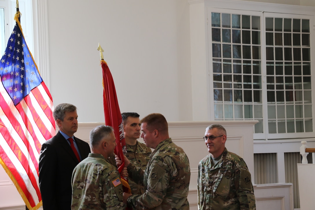 Transatlantic Division Commander Col. Christopher G. Beck passes the flag and command of the Middle East District to Col. Philip M. Secrist III during the Change of Command Ceremony on Thursday, 22 Aug 2019, at the Old Court House in Winchester, Va. Former Commander Col. Stephen H. Bales, Director of Programs Tom Waters and Deputy Commander Lt. Col. Richard Collins also took part in the flag passing ceremony