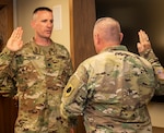 Lt. Col. Loren Easter recites the oath of office following his promotion.