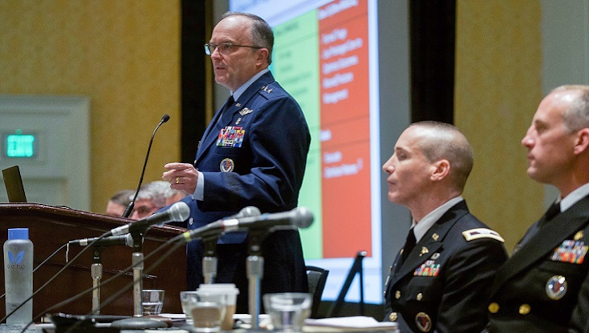 U.S. Air Force Maj. Gen. Lee Payne, assistant director of DHA's Combat Support Agency, moderates a panel presentation on Wednesday, August 21 at MHSRS. (MHS photo)
