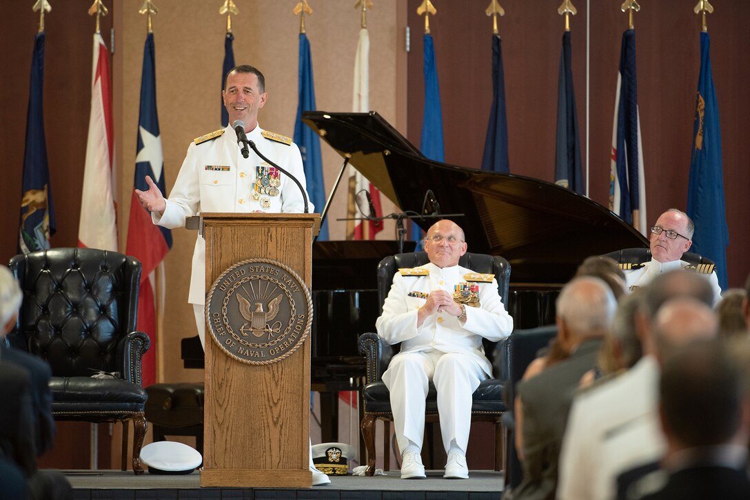 A man speaks at a podium.