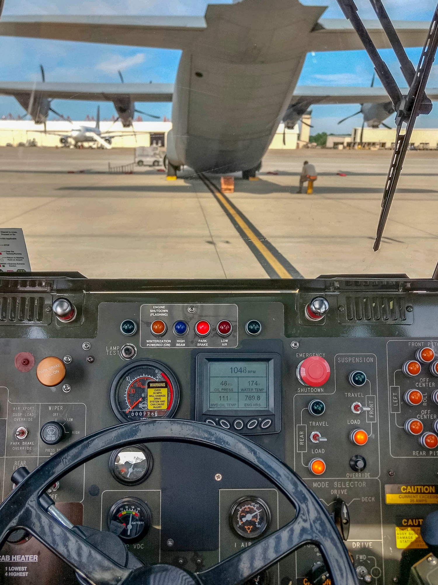 View from a K-loader driver while parked behind a C-130J Hercules during the 96th Aerial Port Squadron annual tour during the month of June 2019 at Norfolk, Va. The K-Loader is a high-reach mechanized aircraft loader that can transport and lift cargo onto military and civilian aircraft. The 96 APS leverages the air transportation network to provide unique training opportunities and resources for the Reserve Citizen Airmen. The Reserves have one weekend a month, two weeks a year to fulfill training in order to prepare for real world missions and requirements. (Courtesy photo)