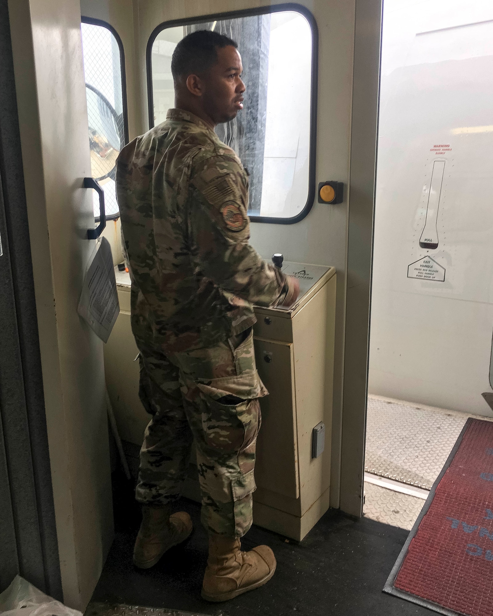 Senior Airman Chase Richards, 96th Aerial Port Squadron air transportation specialist, moves a passenger boarding bridge in place to allow air crew and passenger to board the aircraft at Norfolk, Va. on June 27, 2019. Traditional Reservists have one weekend a month, two weeks a year to fulfill training in order to prepare for real world missions and requirements, ensuring strategic depth and readiness. The 96 APS leverages the air transportation network to provide unique training opportunities and resources for the Reserve Citizen Airmen. (Courtesy photo)